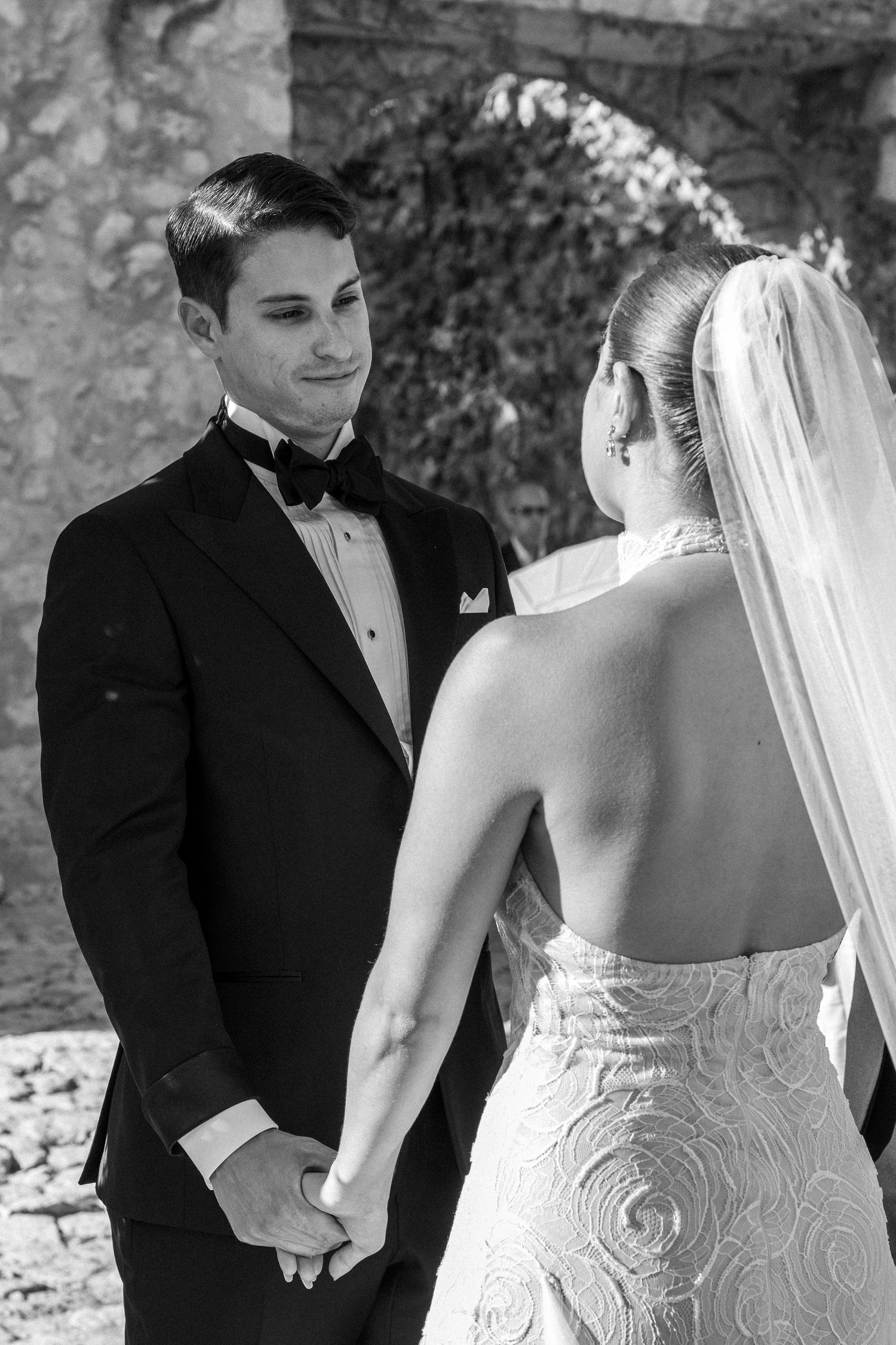 Intimate black and white wedding portraits showing couple in formal attire.