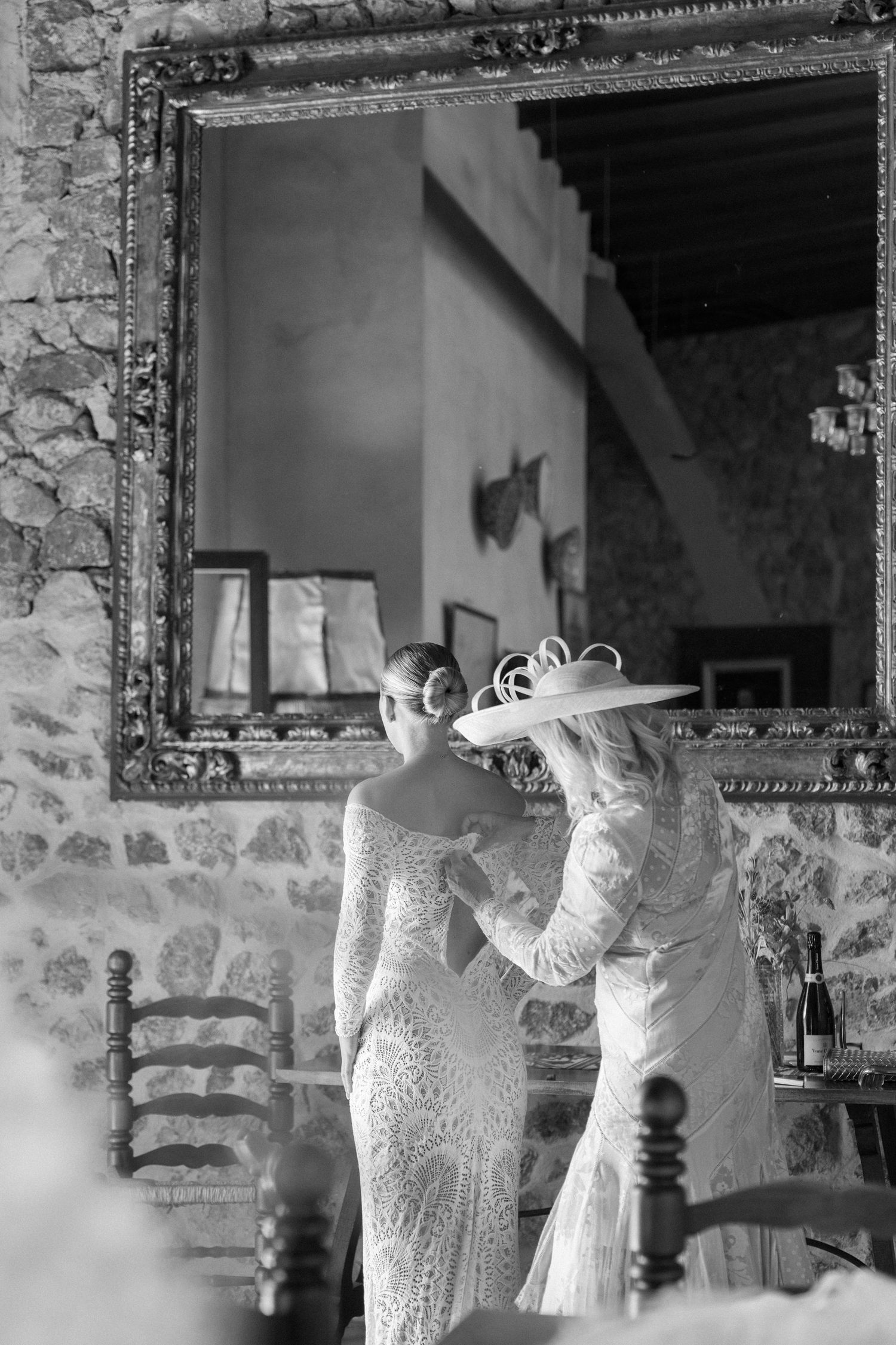 Wedding dress preparations captured in a series of elegant mirror reflections.