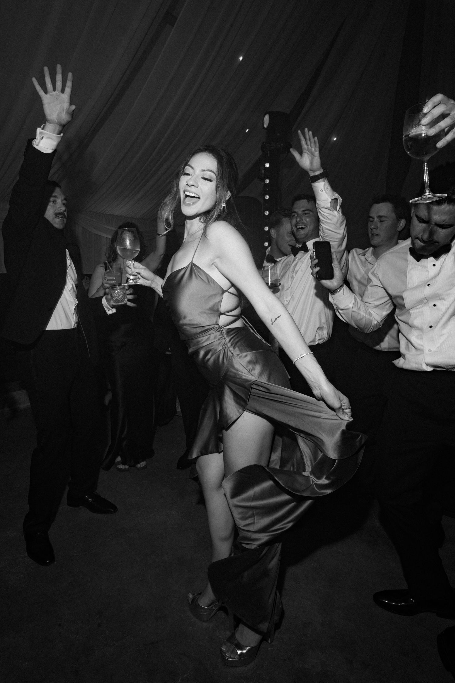 Black and white photos show dancers at a lively party moving energetically on a dance floor.
