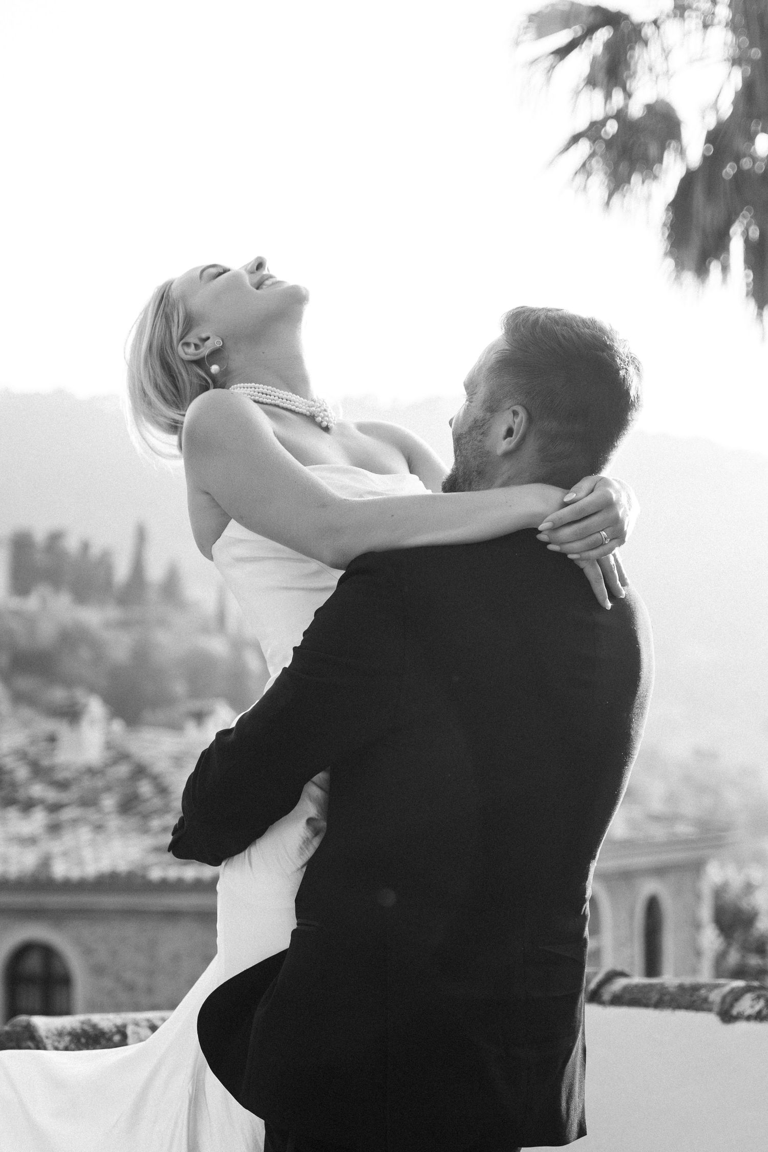 Romantic black and white sequence of newlyweds sharing intimate moments outdoors.