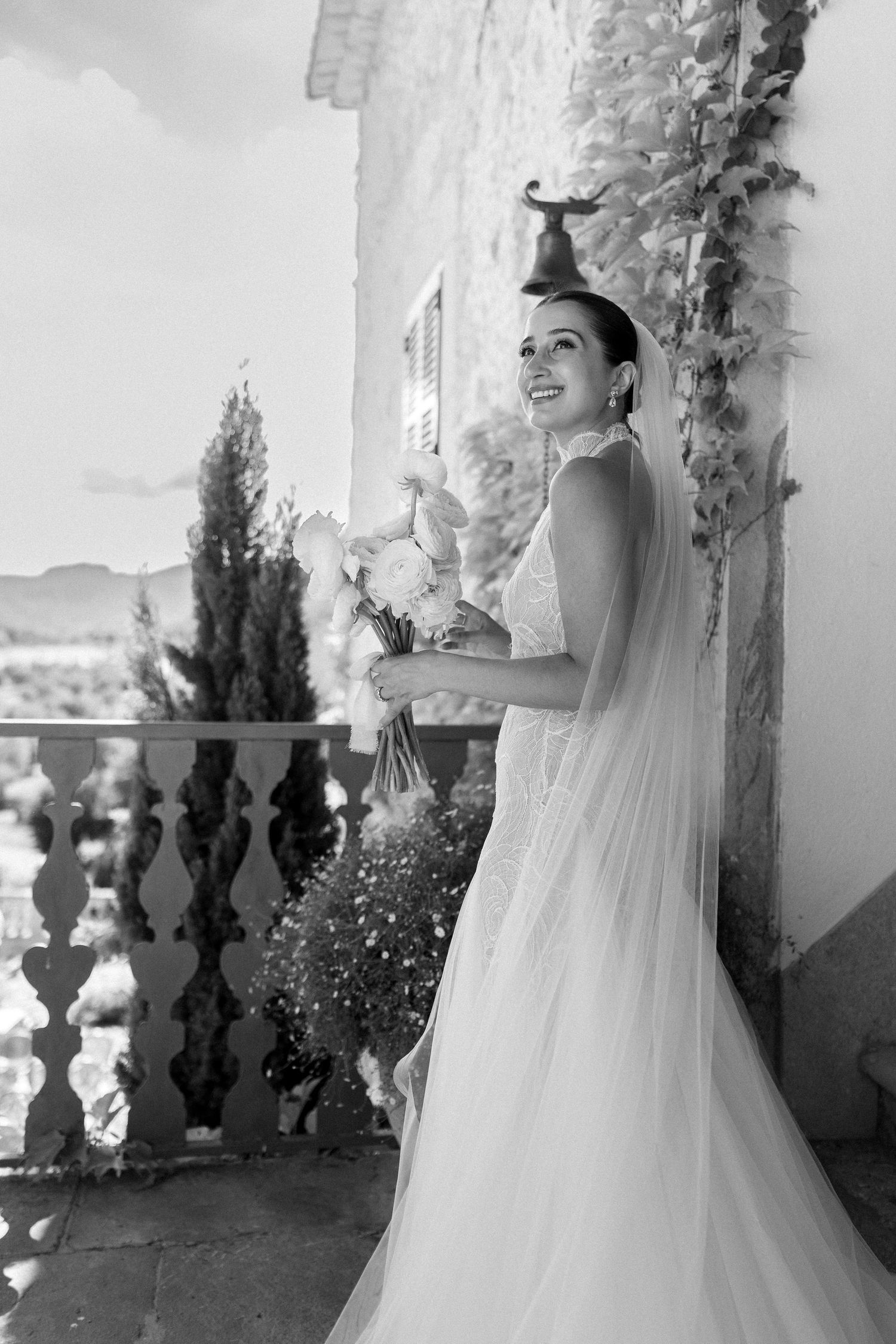 Bride in flowing dress stands against ivy-covered wall in sequence.