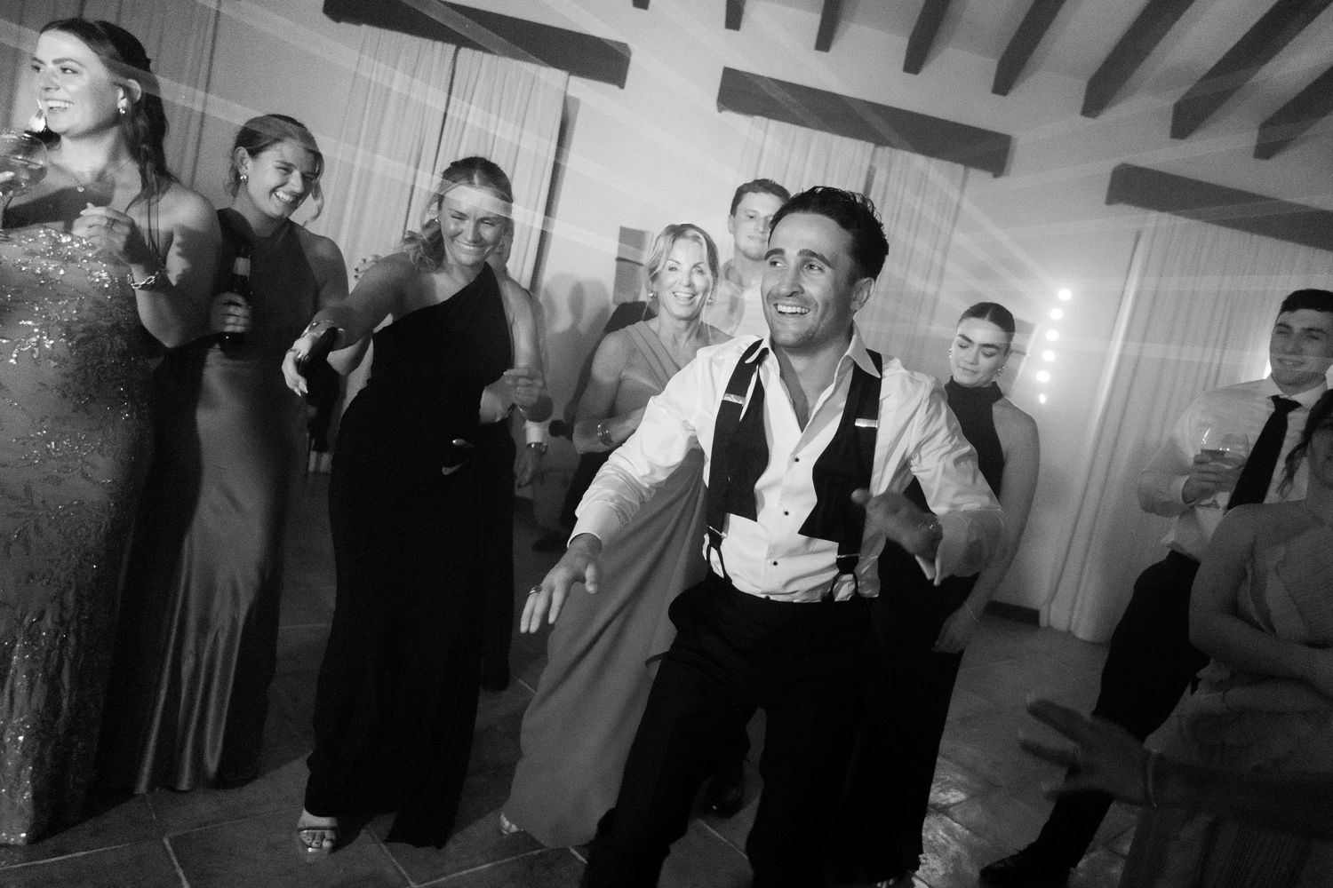 A black and white photo montage showing people in formal attire at what appears to be a social gathering or event.