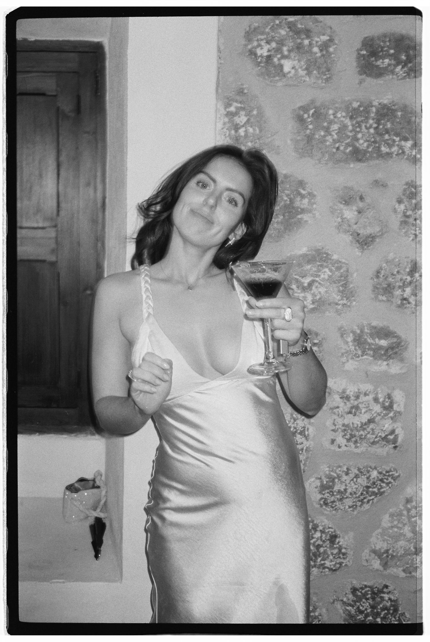 Black and white party photos showing celebration with drinks at a wedding reception.