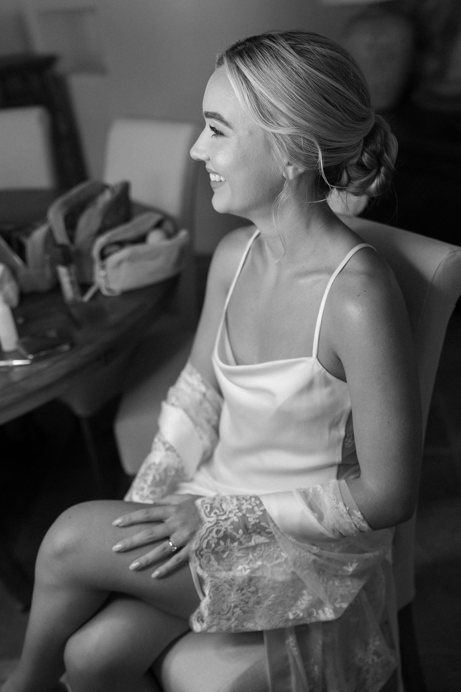 Black and white candid moments during wedding day preparations.