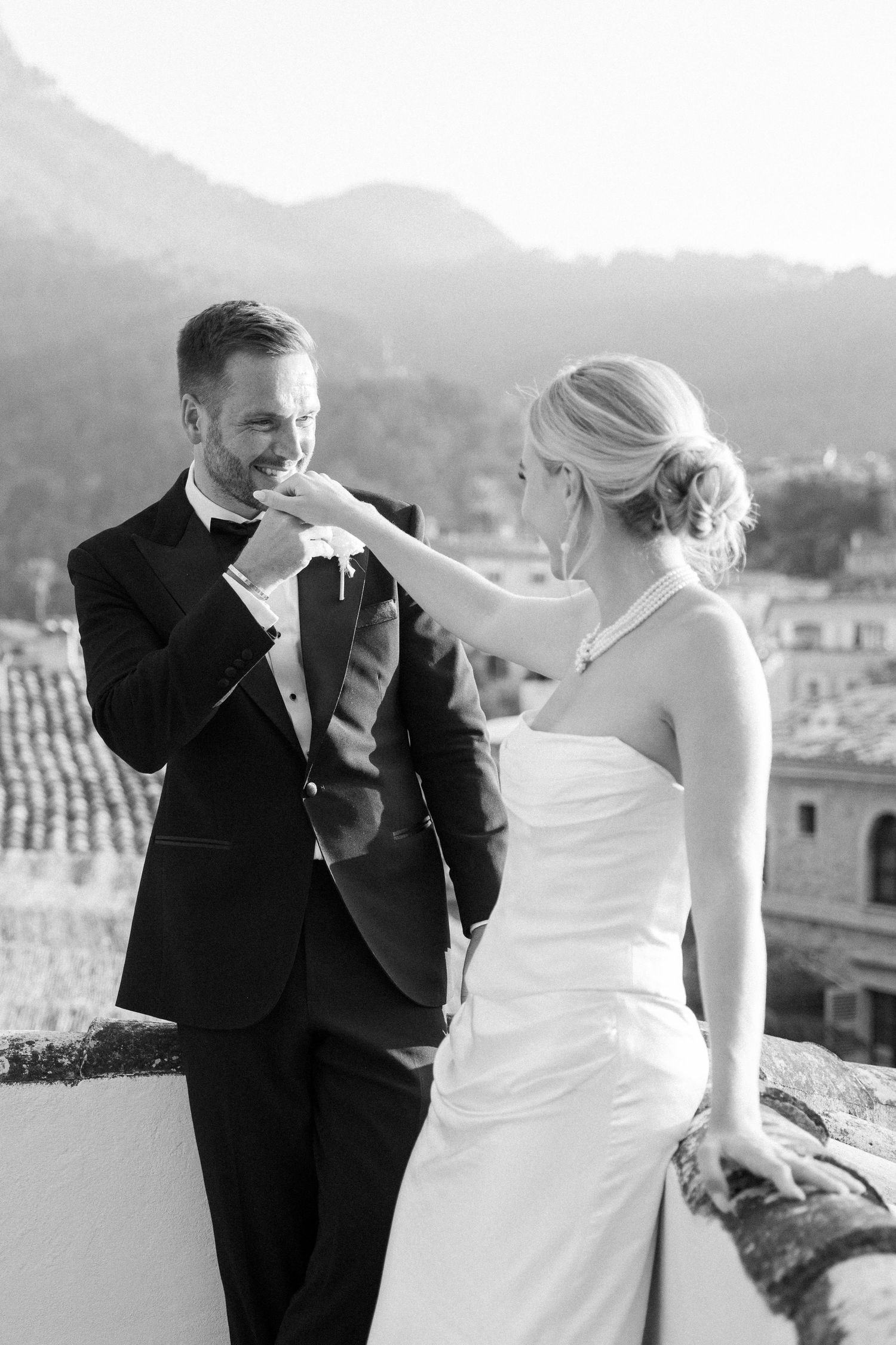 Romantic dance sequence captured against a mountainous backdrop at sunset.