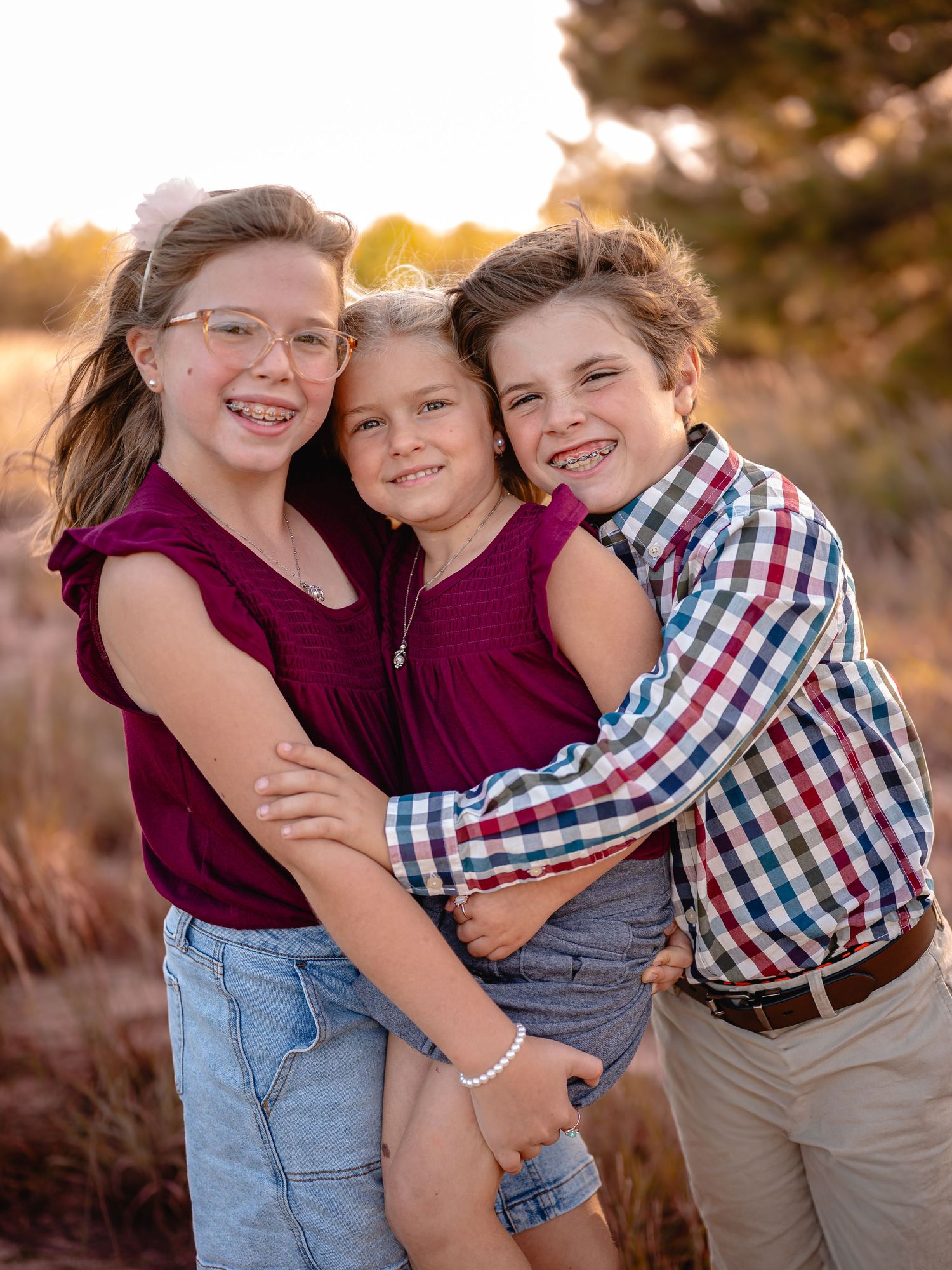 Siblings smiling and laughing during fall photo session, Chesapeake Virginia family photography.