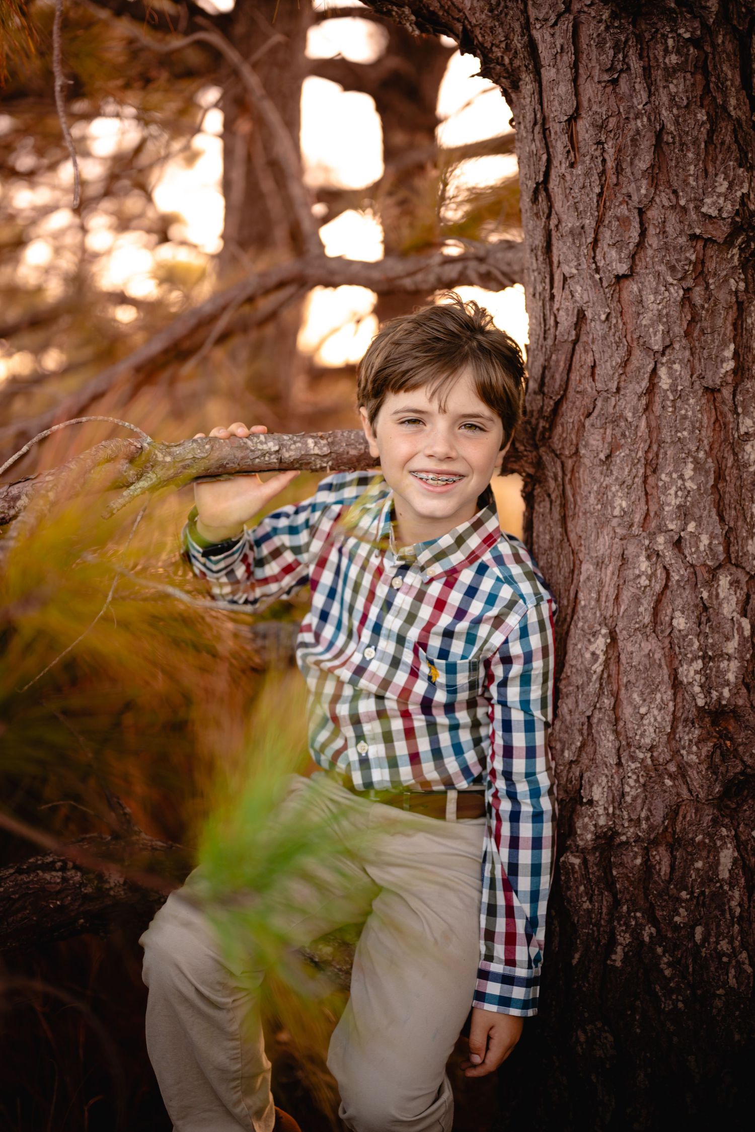 Son hitting in the trees during golden hour, Chesapeake VA family photography by Kylee Mason.