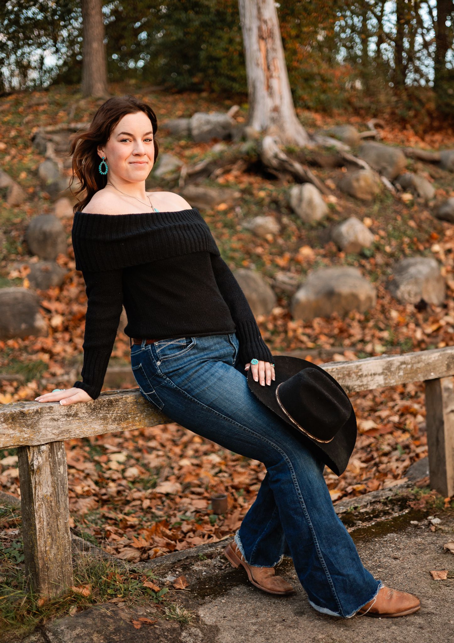 high school senior girl with a black sweater and cowgirl hat in Pendleton, IN
