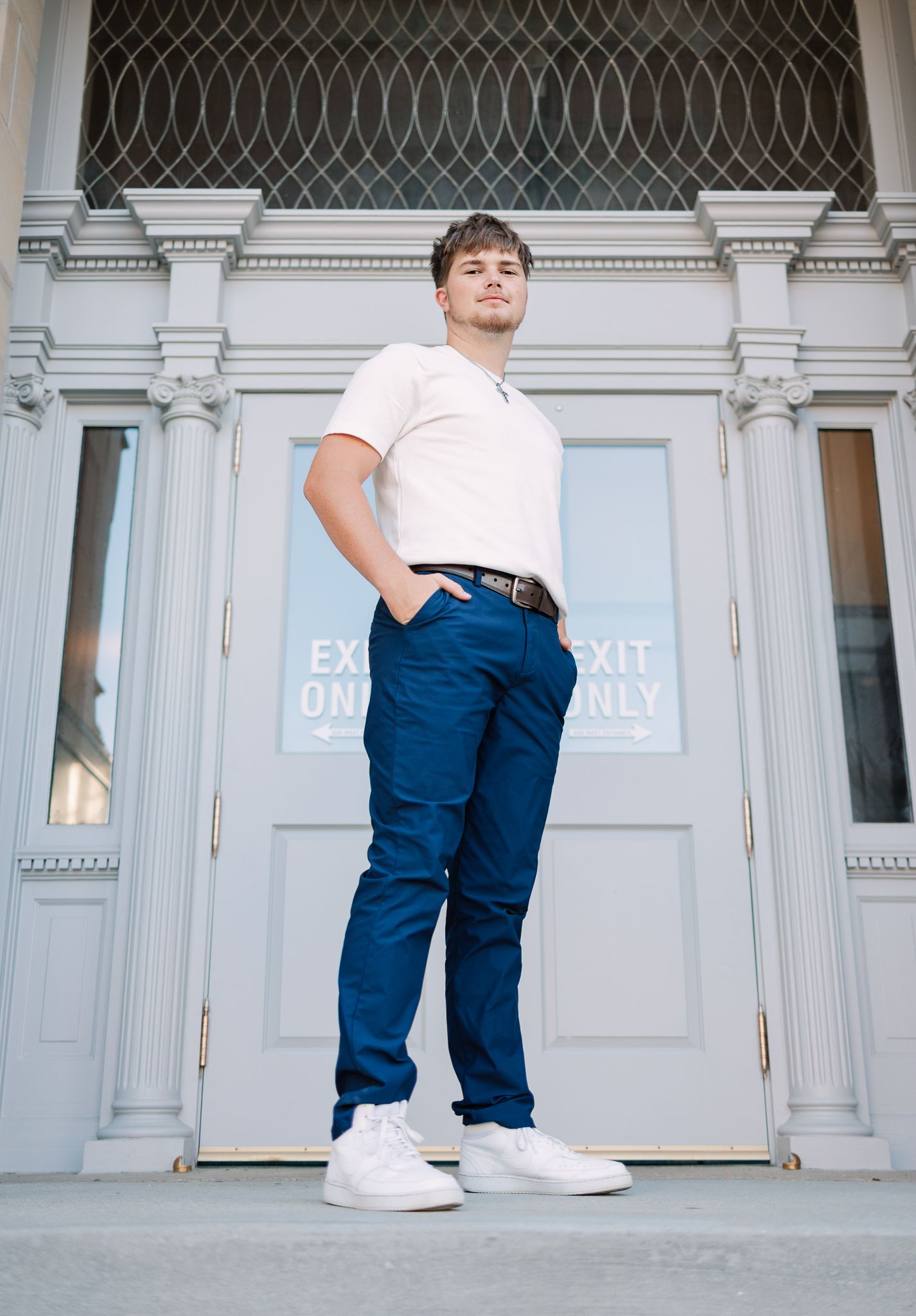 senior standing in front of an old courthouse in Noblesville, IN