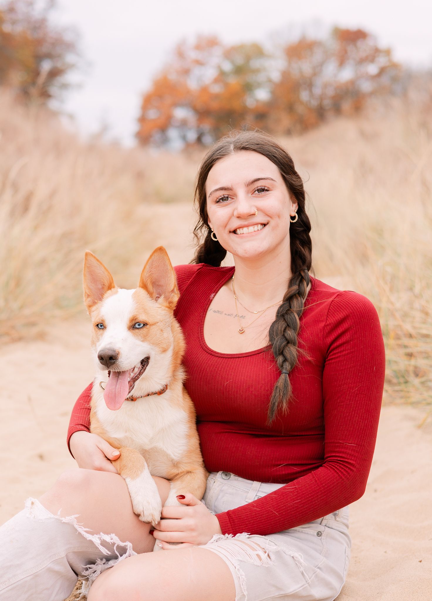 senior girl with red shirt and cattle dog in Michigan