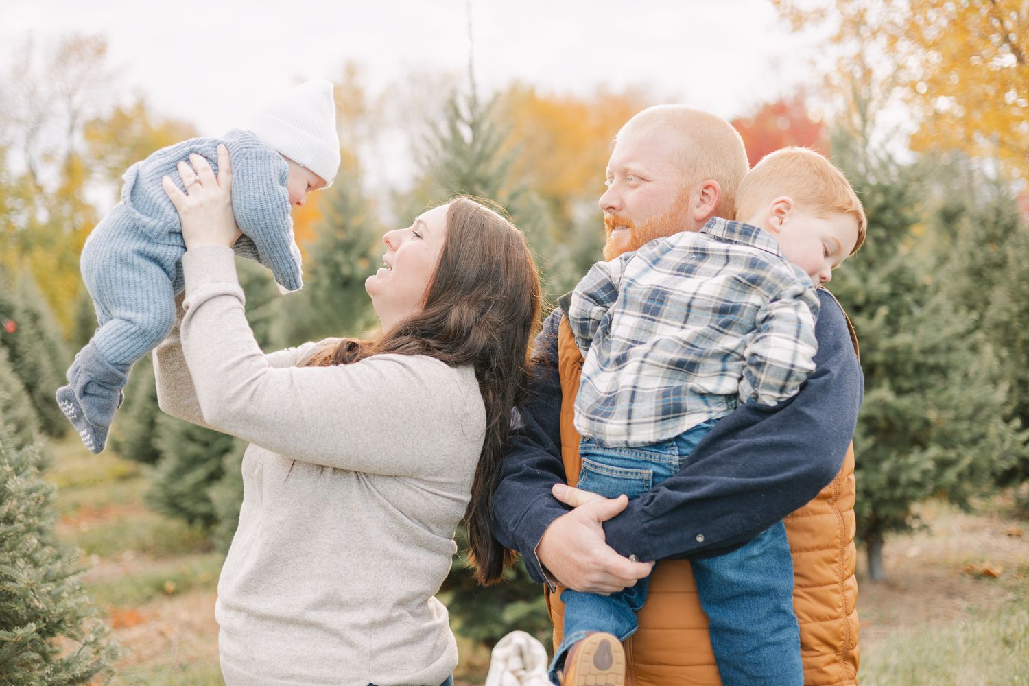 christmas photo at tree farm family of four