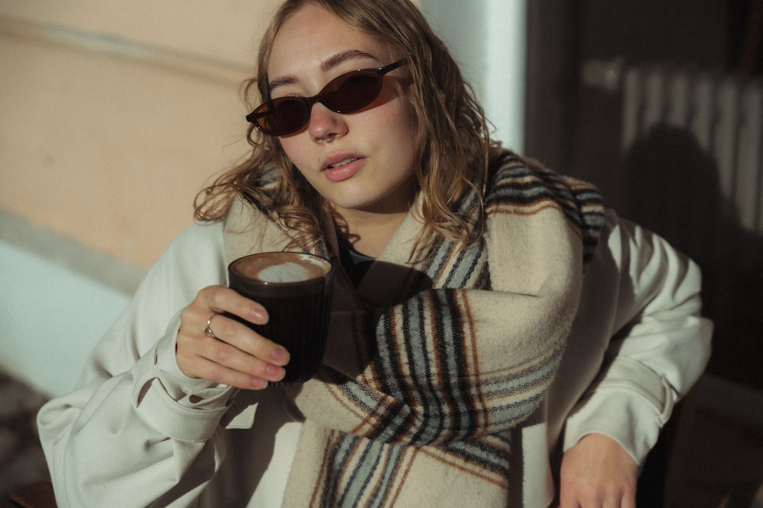 Fashion photography series featuring winter accessories and sunglasses in natural lighting.