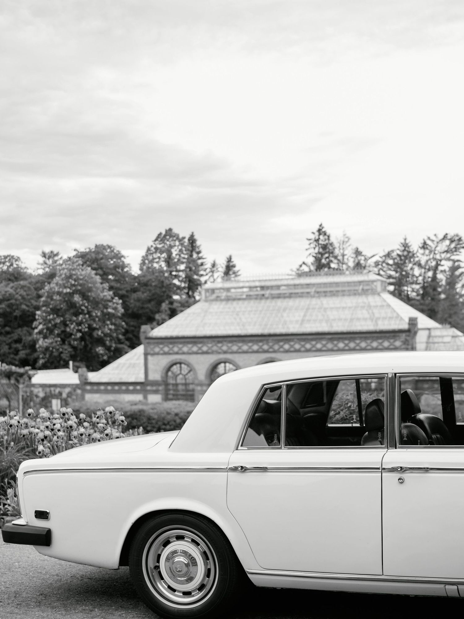A classic white 1956 Lincoln Continental Mark II luxury car shown from multiple angles in a black and white photograph.