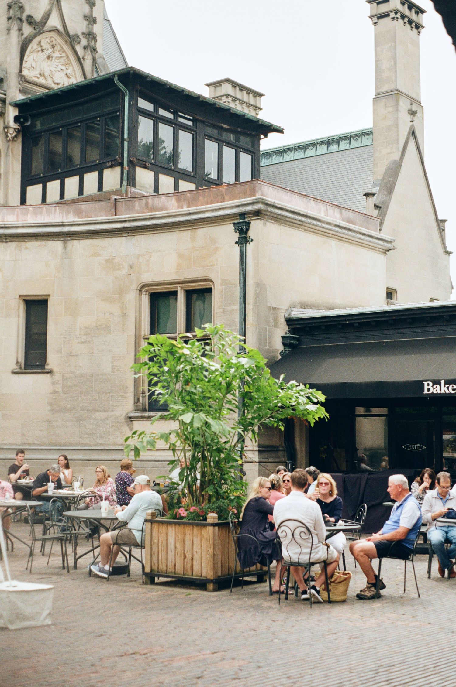 People eating next to the Biltmore estate house
