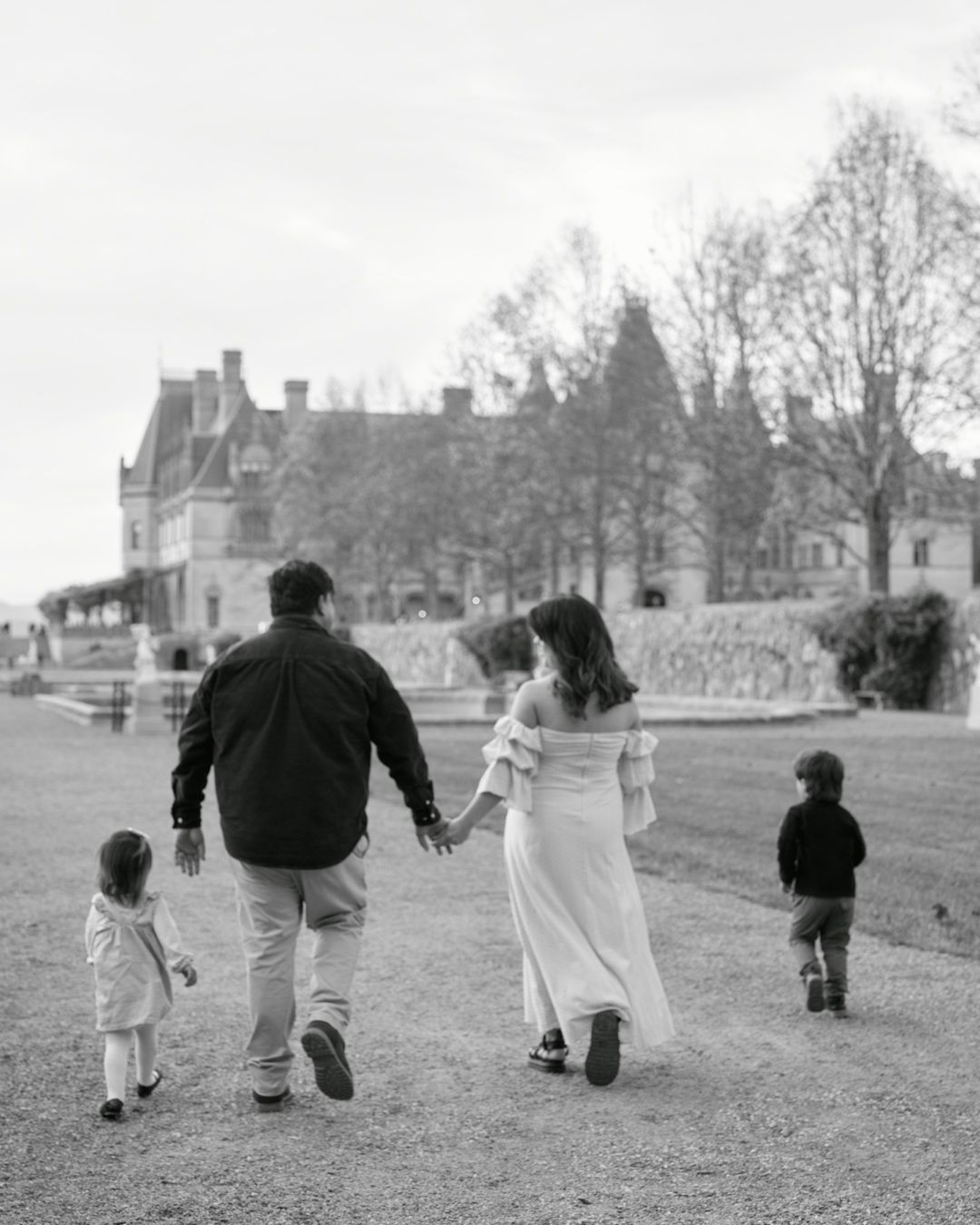 A sequence of black and white photos showing a family walking together across a grassy field.