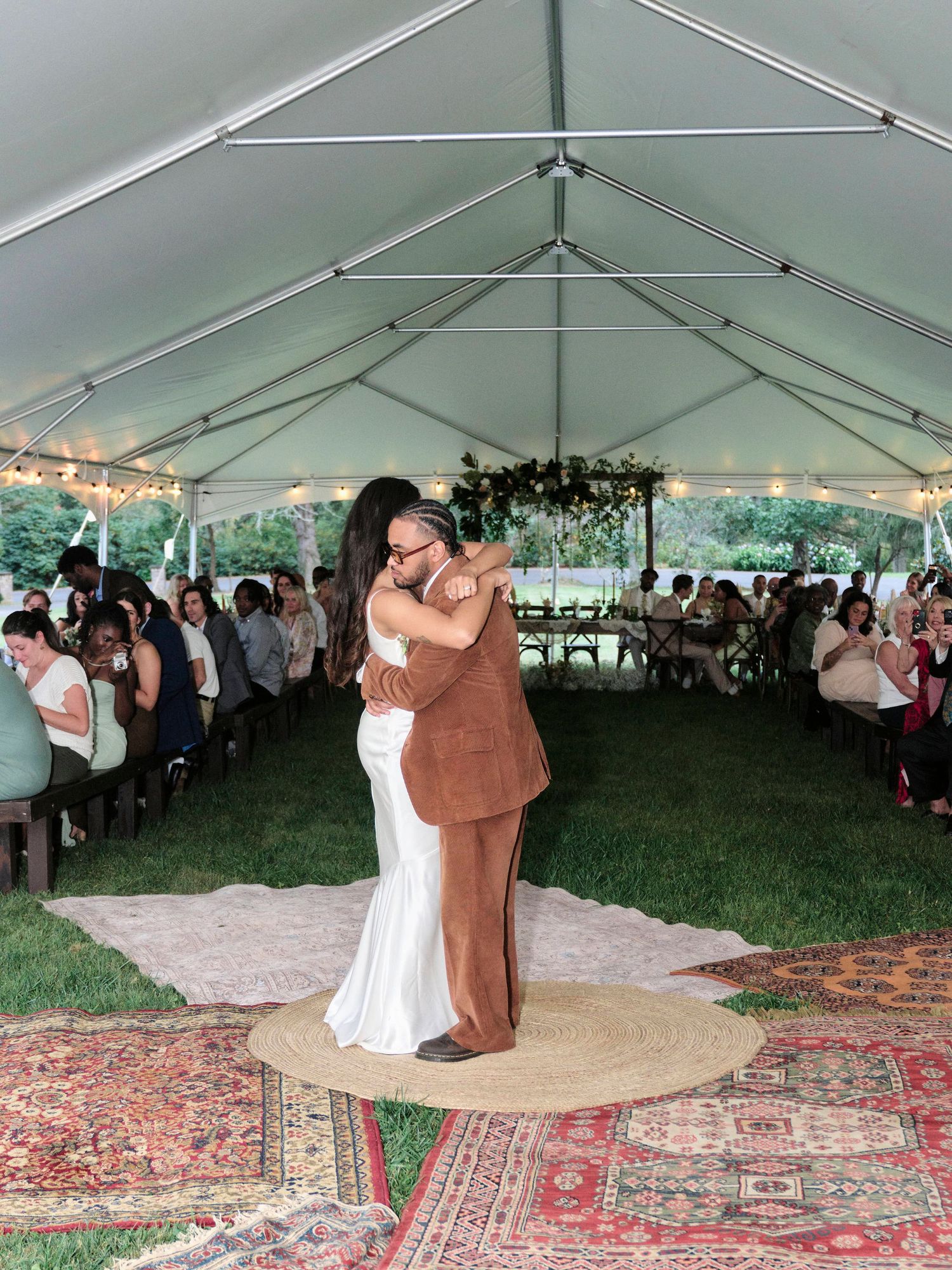 Bride and groom first dance under their tent style wedding.