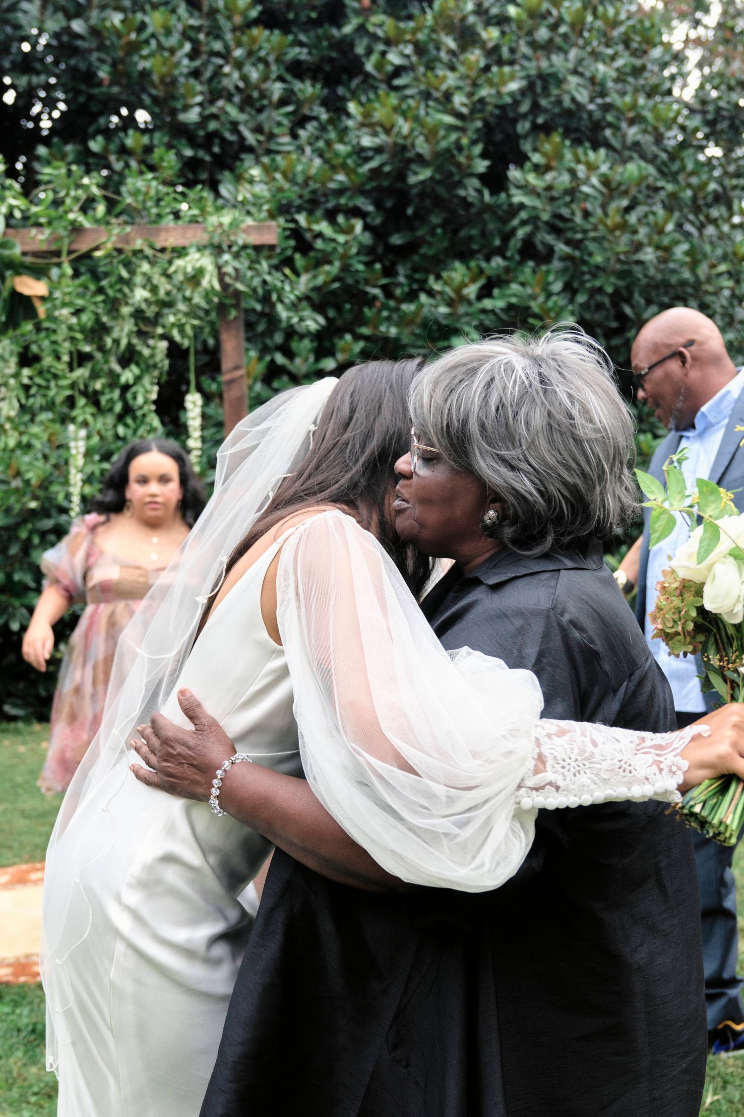 Bride hugging her grandma after the wedding ceremony.