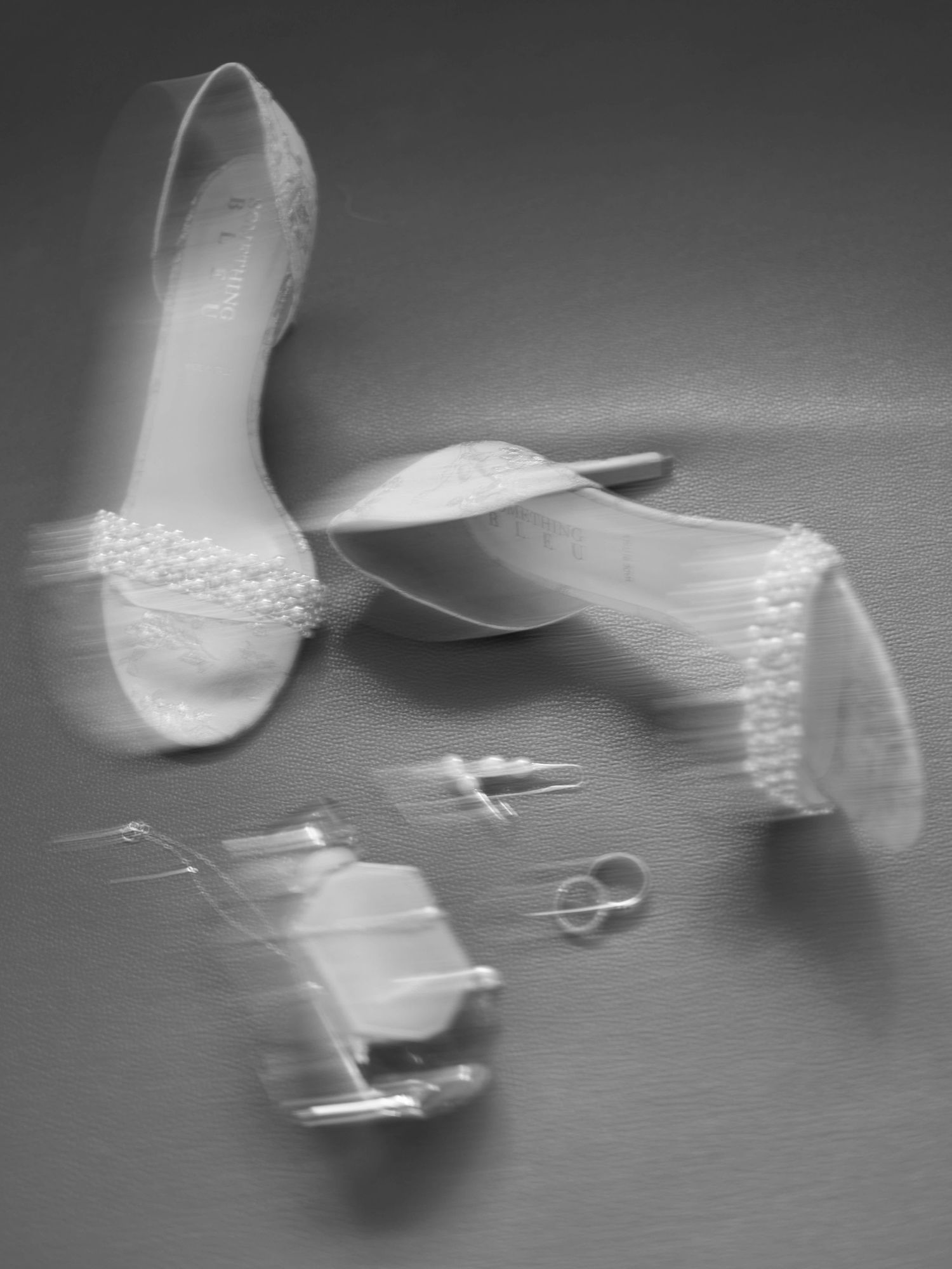 Details of bride shoes next to a window at the Grand Bohemian Asheville, NC Wedding Photography