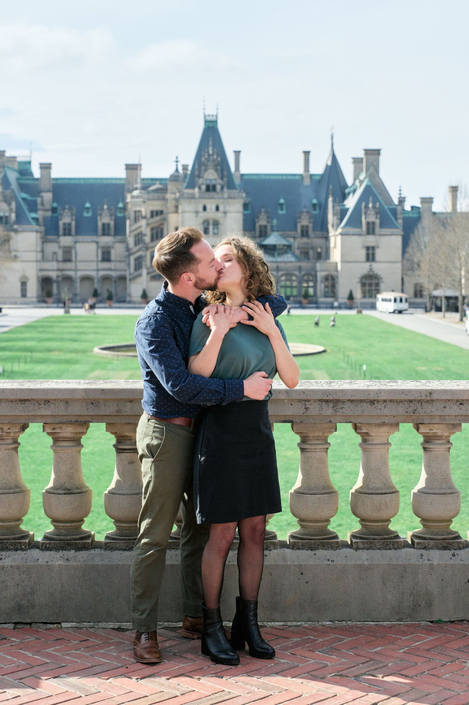 Portrait of a couple kissing at the Biltmore Estate during their engagement session