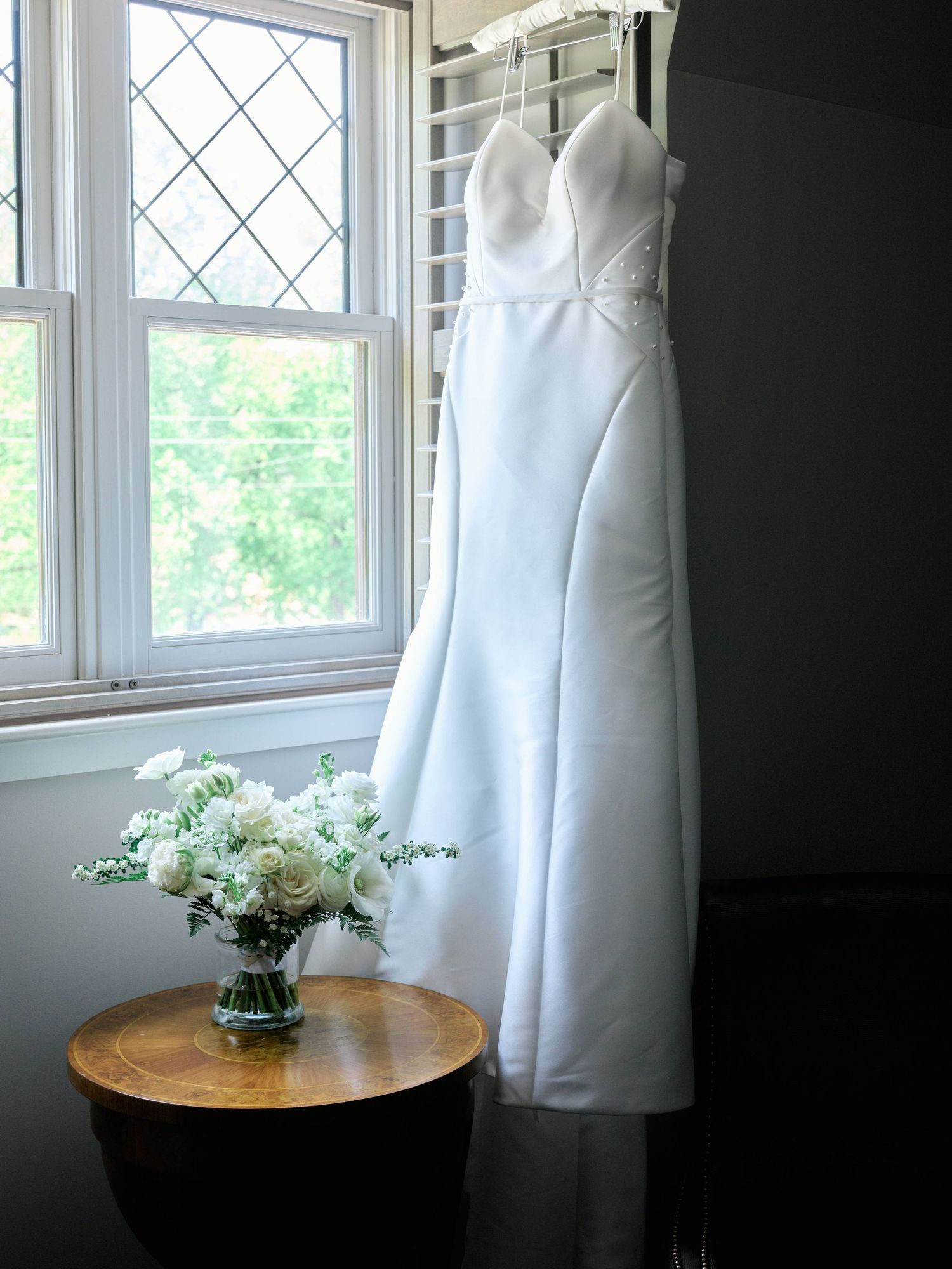 bridal dress hanging from the window of the grand bohemian hotel in Asheville, NC