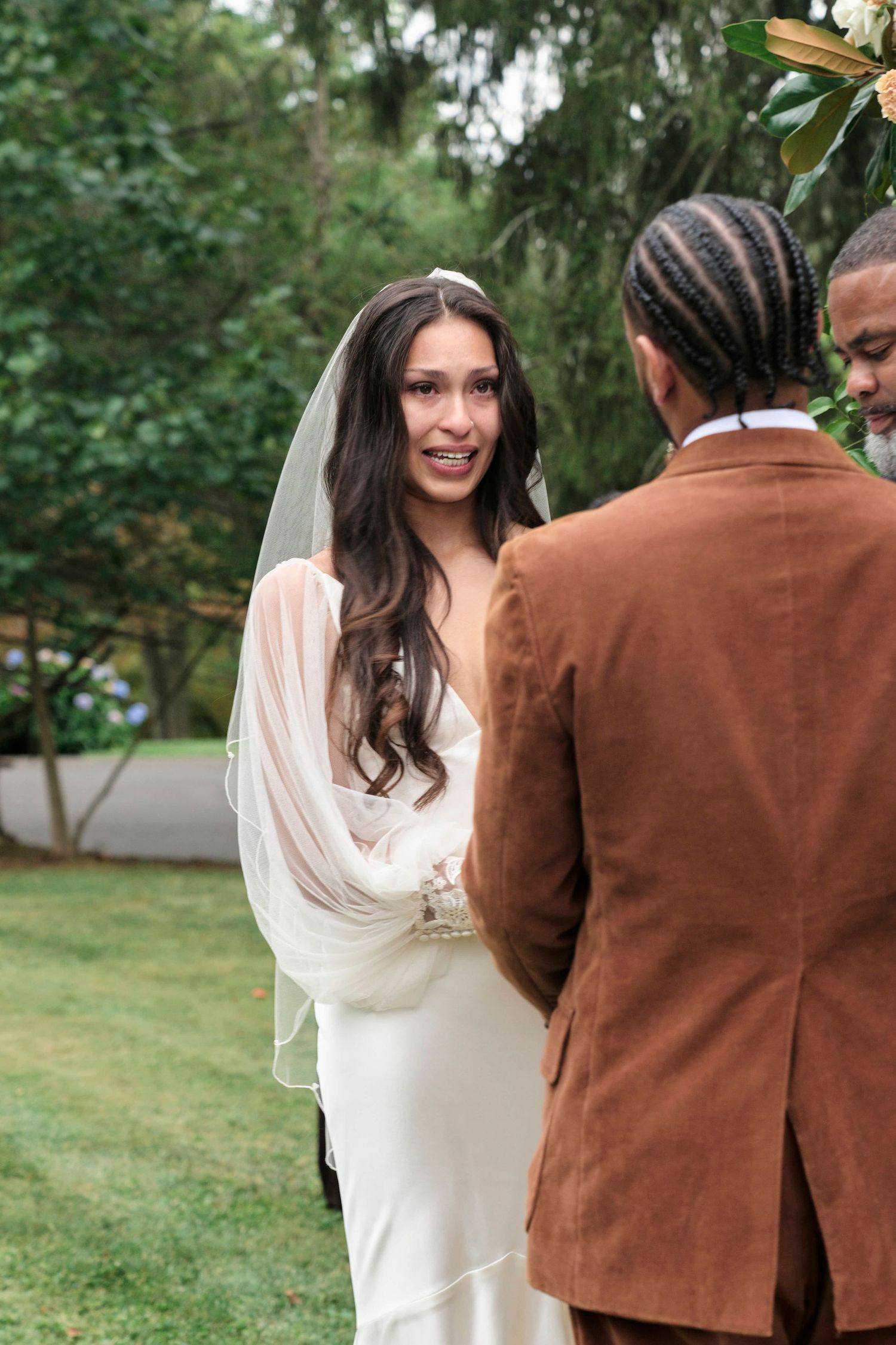 Photo of bride crying during her wedding ceremony