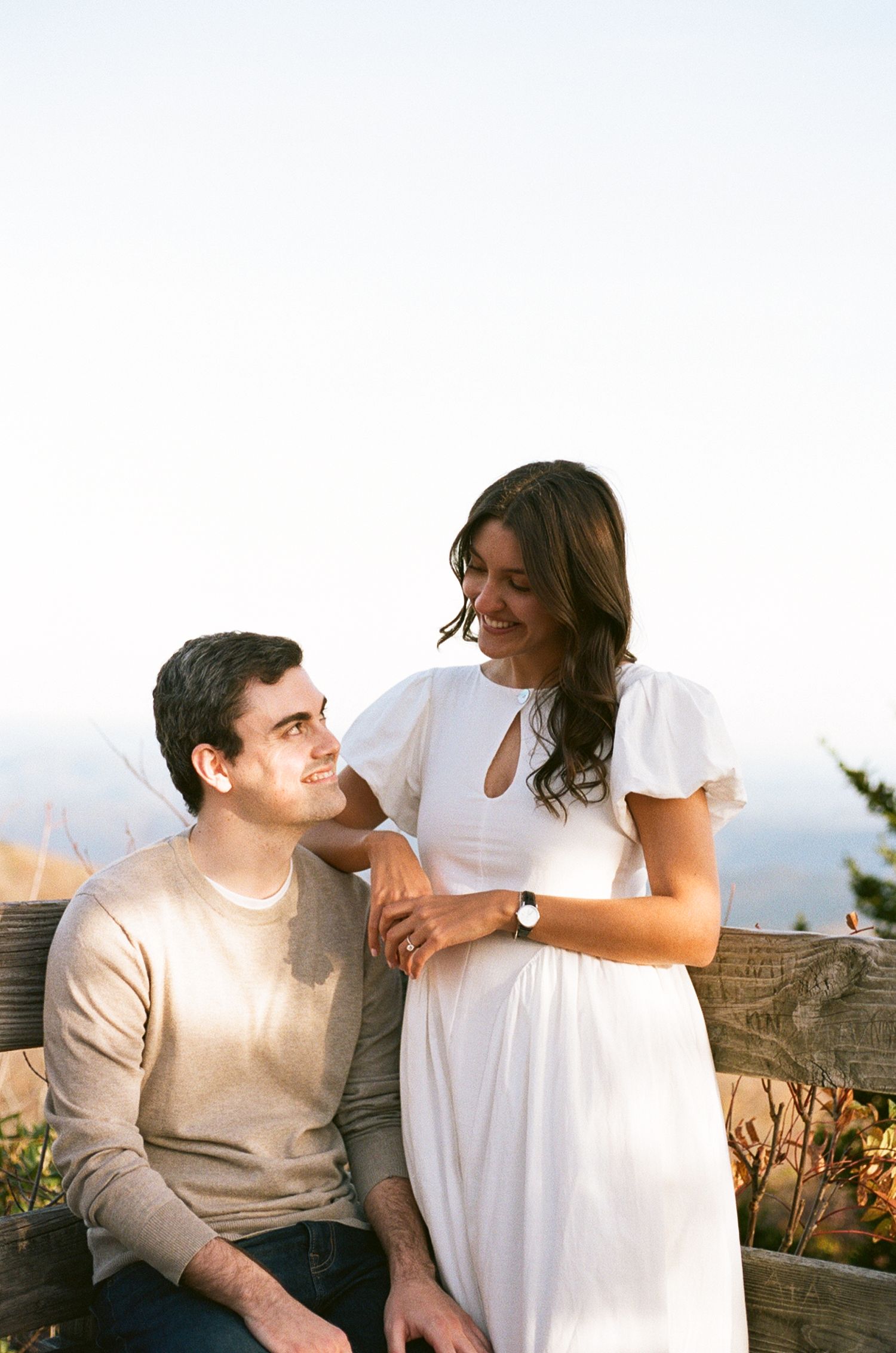 A couple shares tender moments together outdoors during sunset in a series of connected romantic photos.