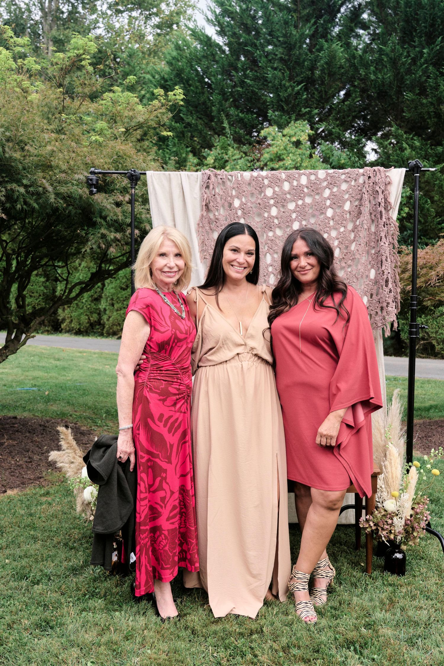 The mother of the bride with her friends during her daughters wedding.