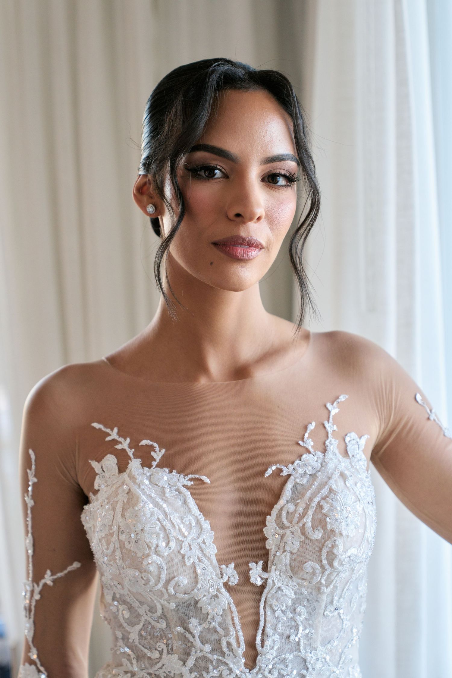 Elegant bridal portrait showcasing delicate lace wedding dress details.