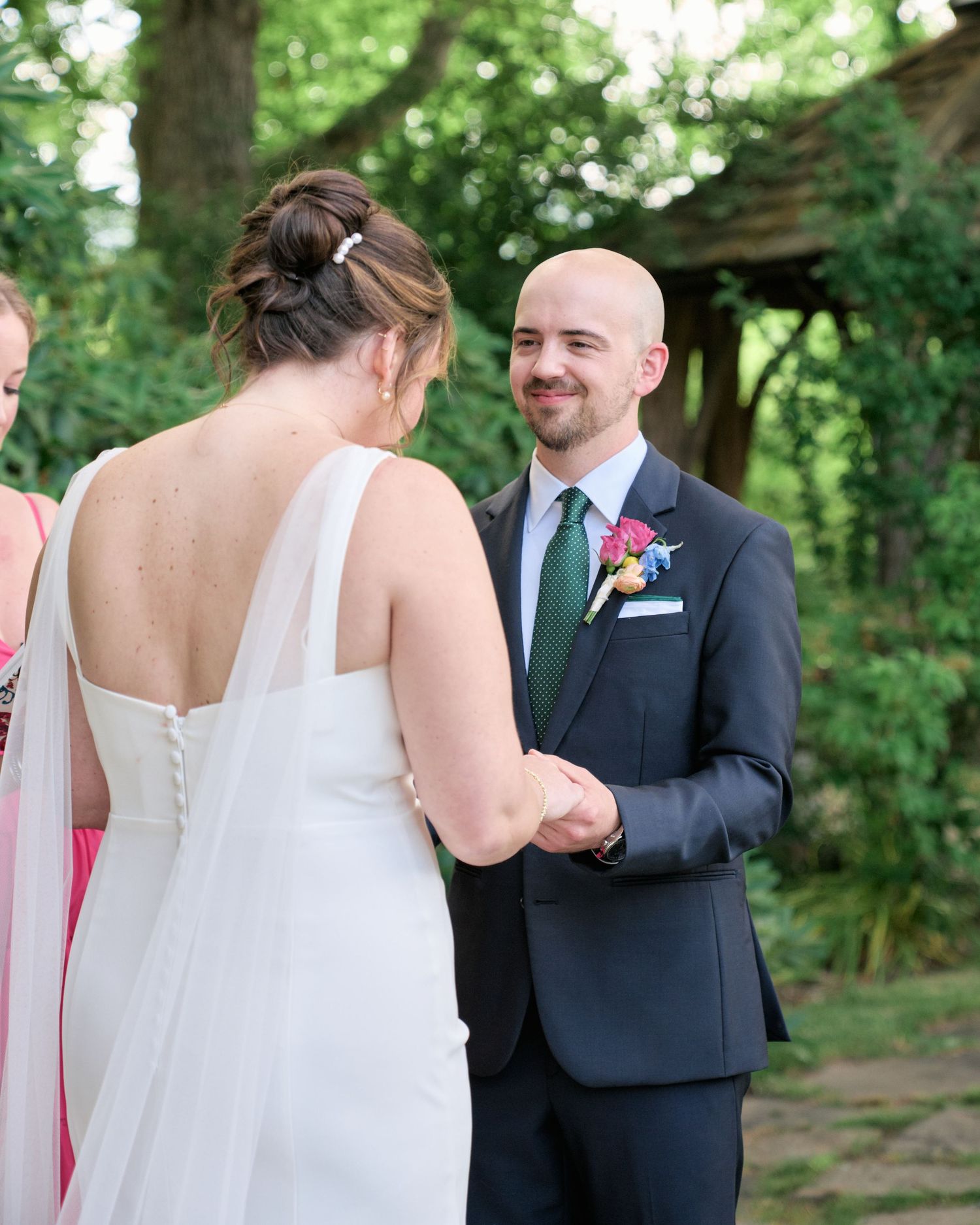 Exchange of vows during outdoor forest wedding ceremony.