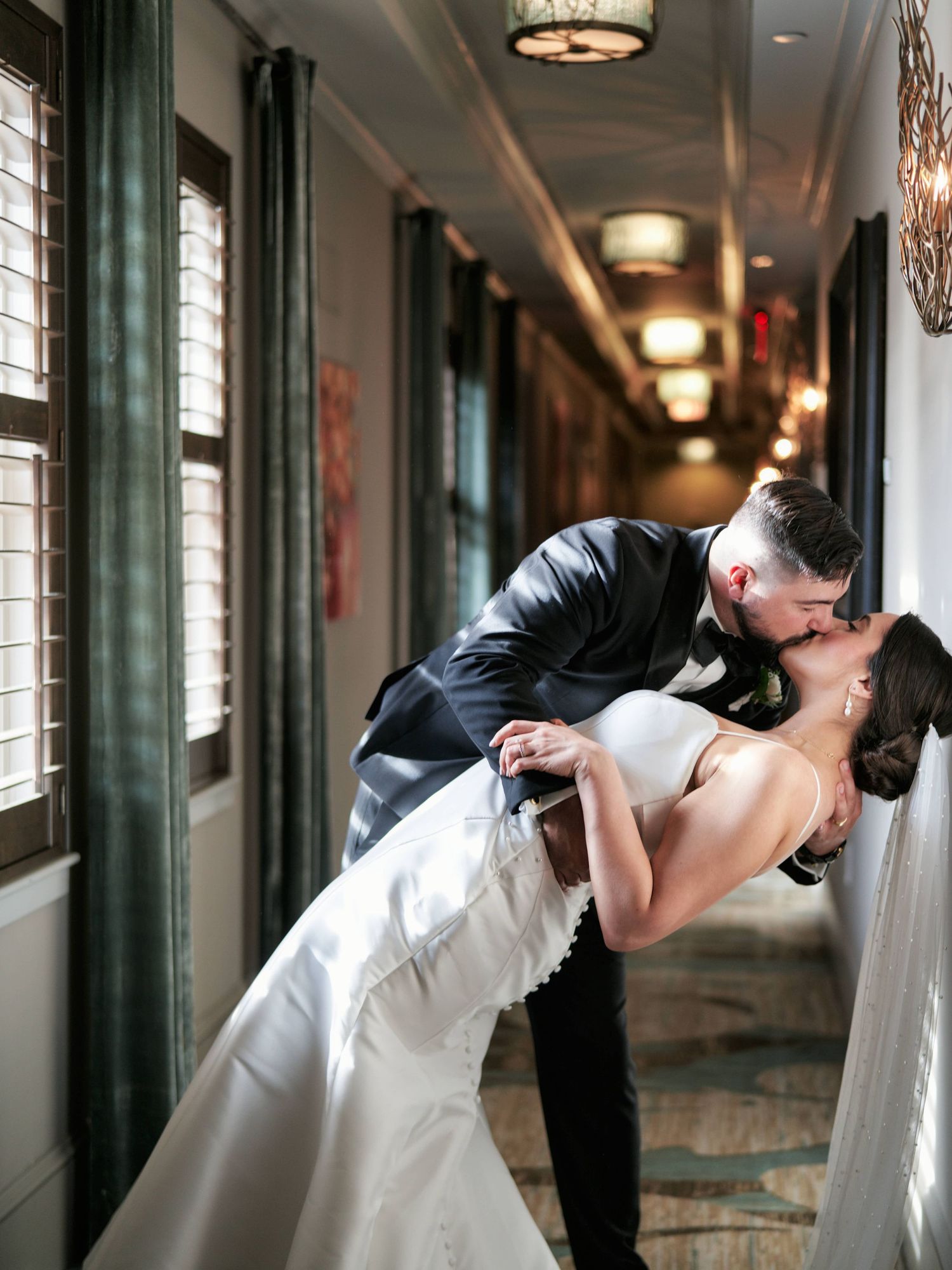Bride and groom kissing inside the Grand Bohemian hotel in Asheville.