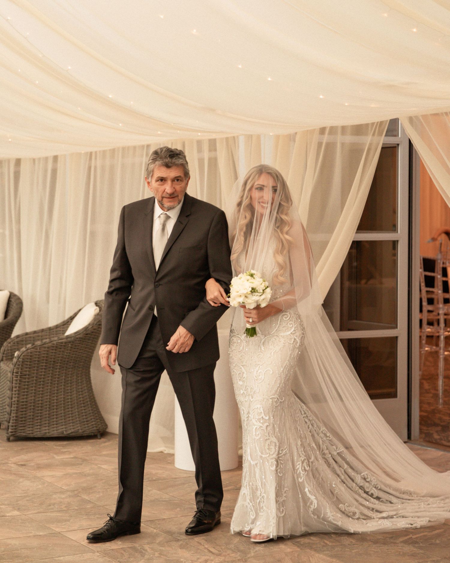 A sequence of wedding photos showing dress details and formal attire in a light-filled venue with white drapes.