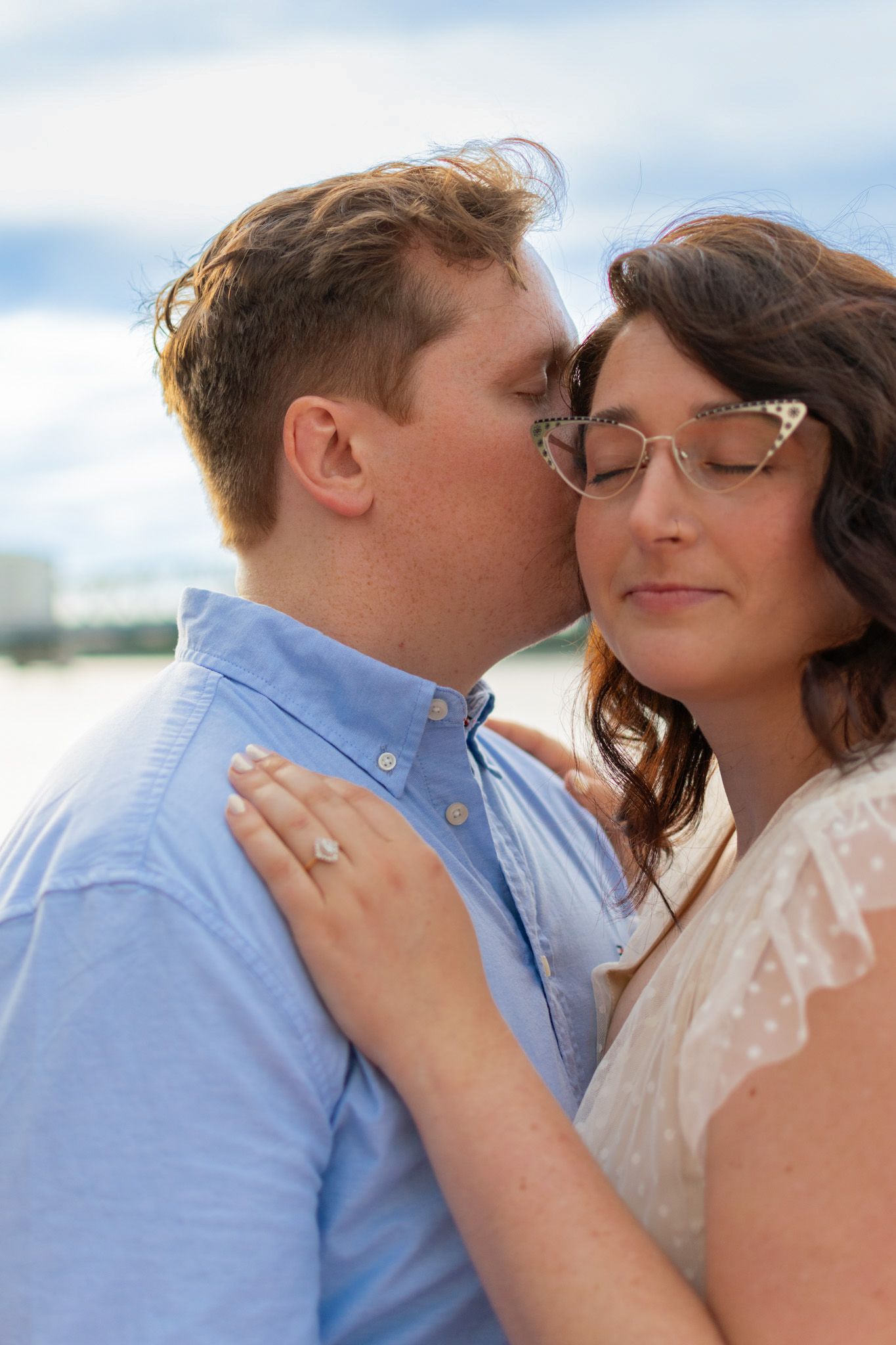 Close-up couple portrait sharing an intimate moment during a lifestyle engagement session