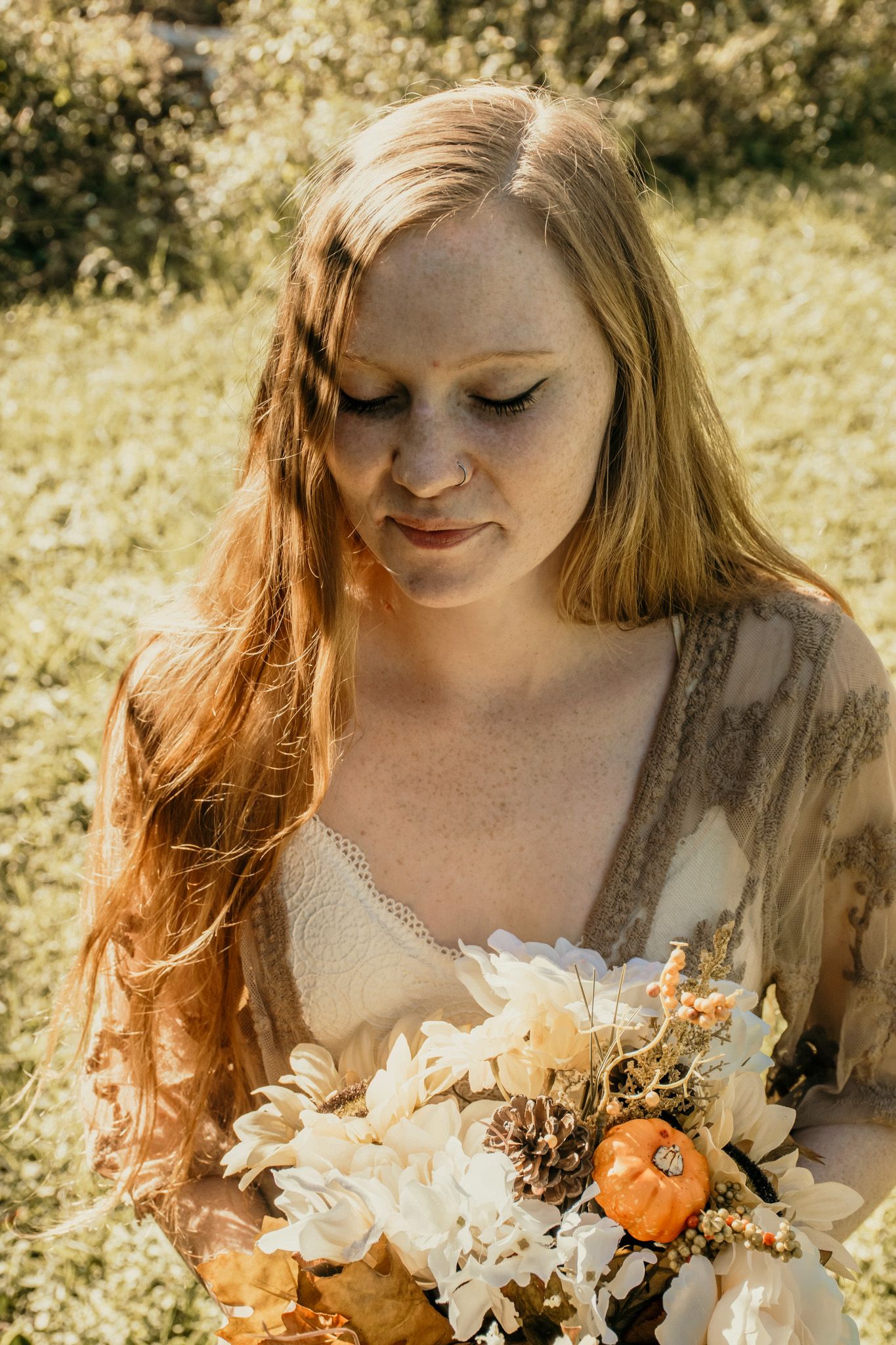 Portrait of a woman holding flowers in a soft natural light outdoor lifestyle photography session