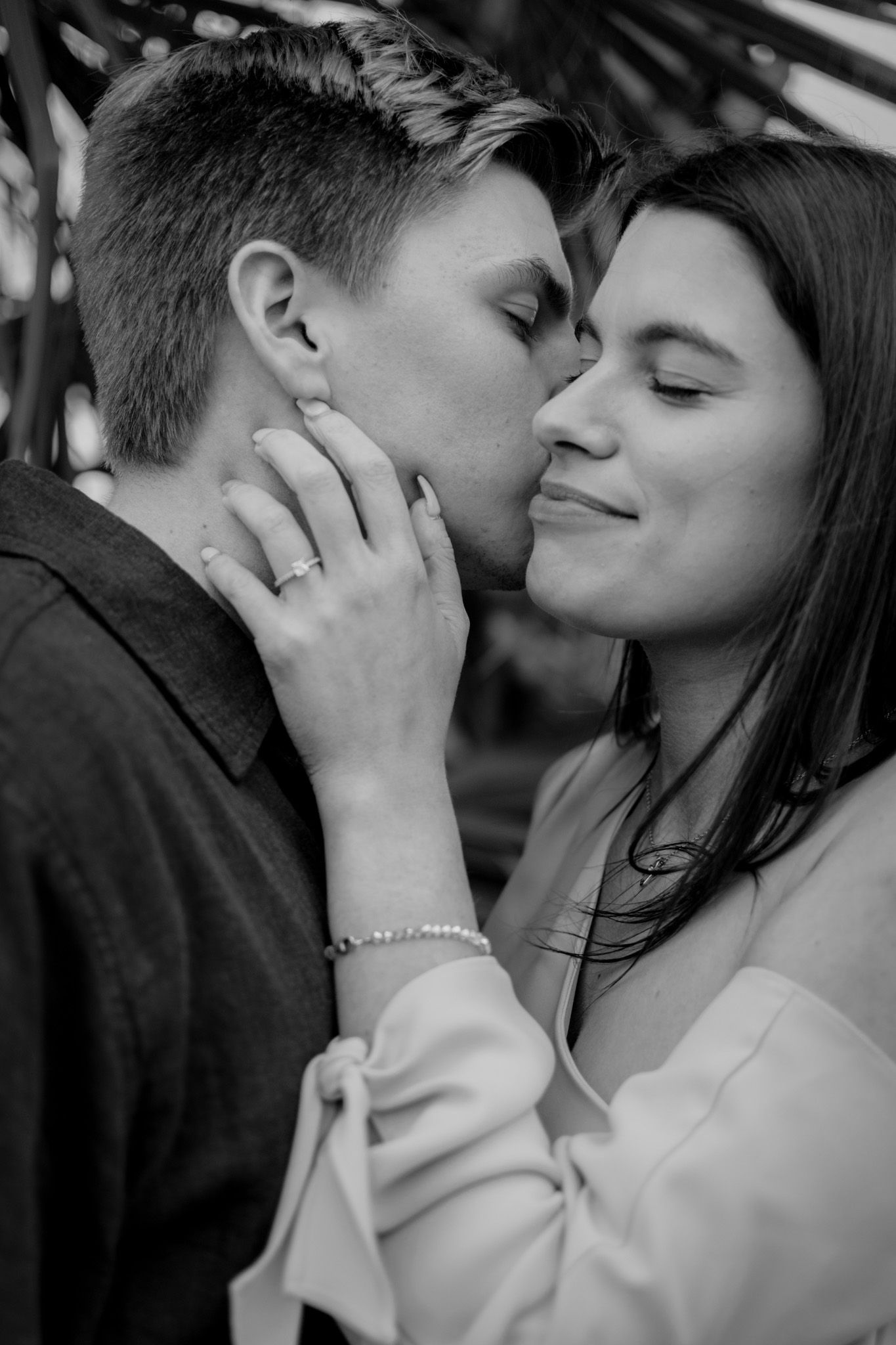 Black and white closeup of couple embracing in engagement session