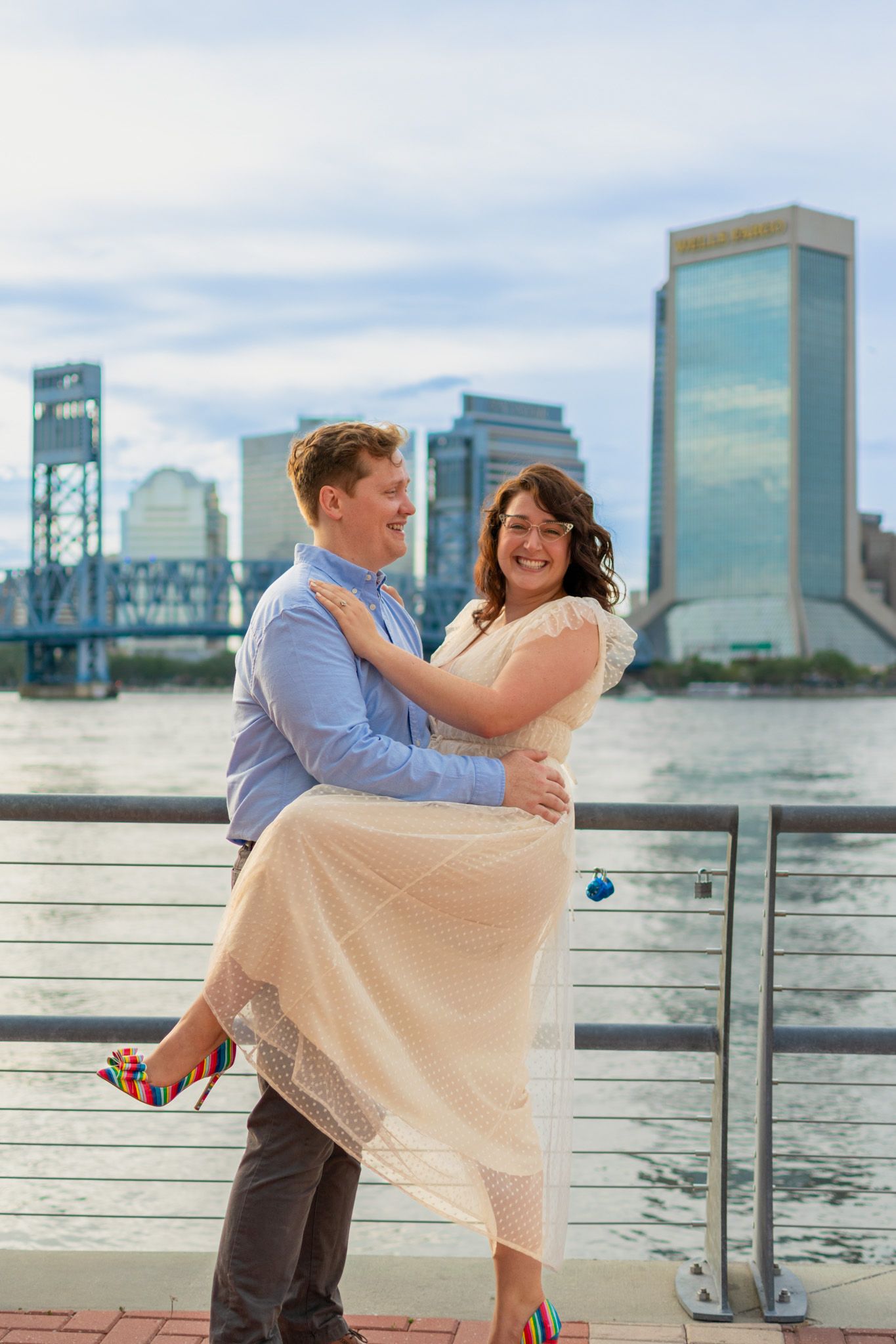 Couple embracing in an urban setting during a modern lifestyle engagement photoshoot