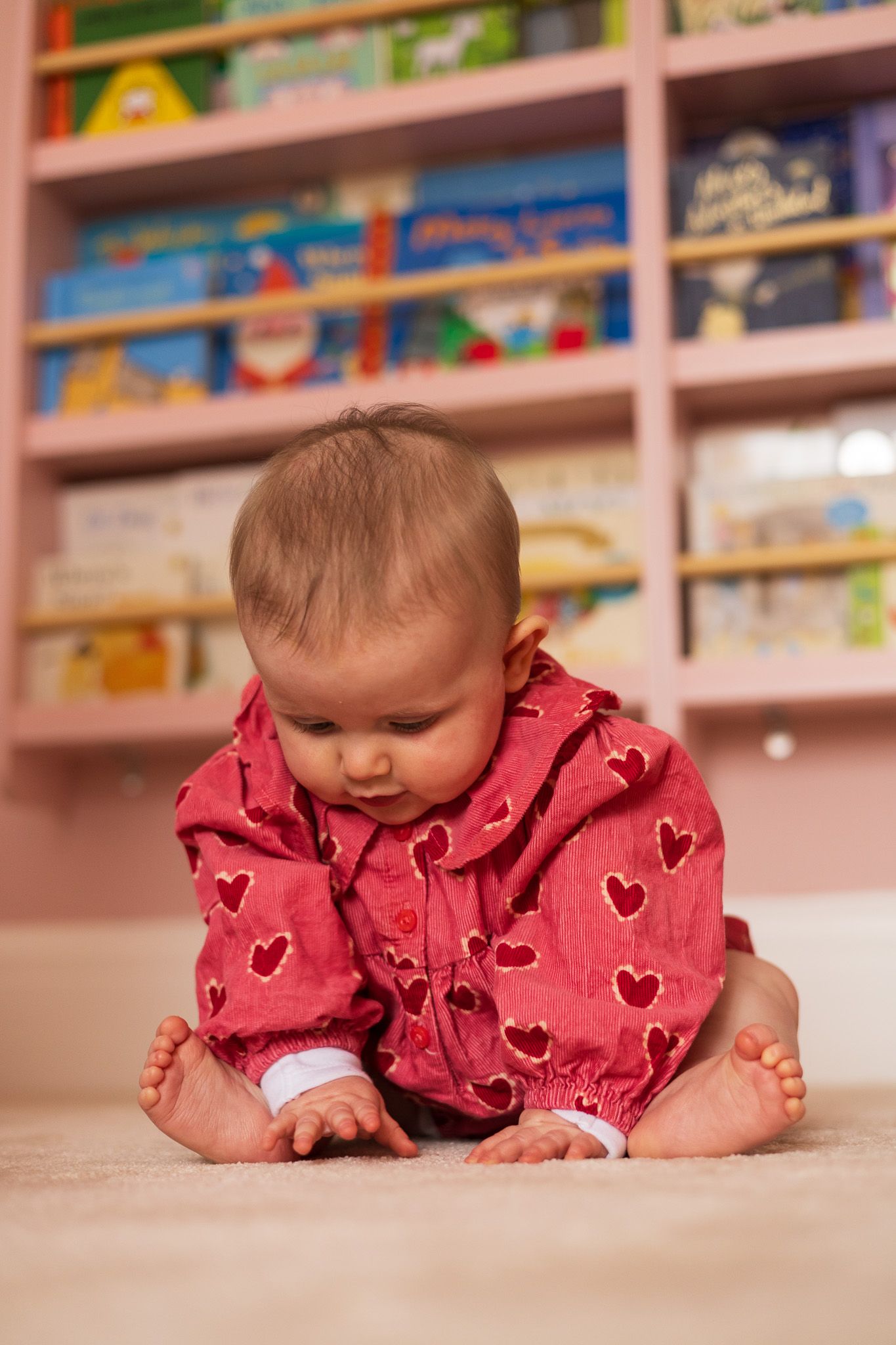 Baby crawling on the floor in a playroom