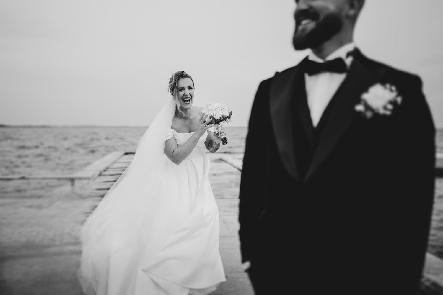 Black and white wedding portraits showing intimate moments between newlyweds.