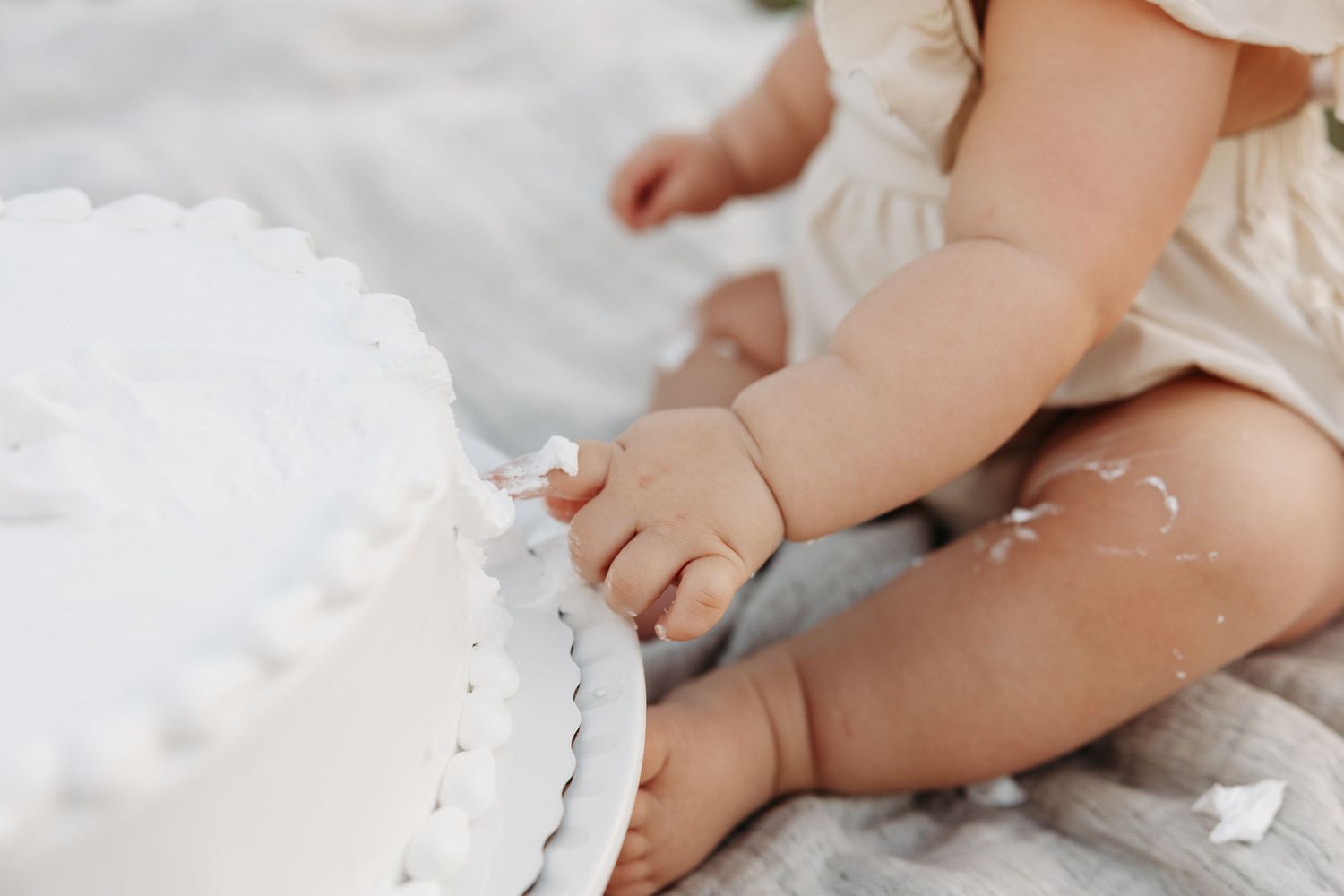 Small baby feet covered in flour while playing in the kitchen during baking.