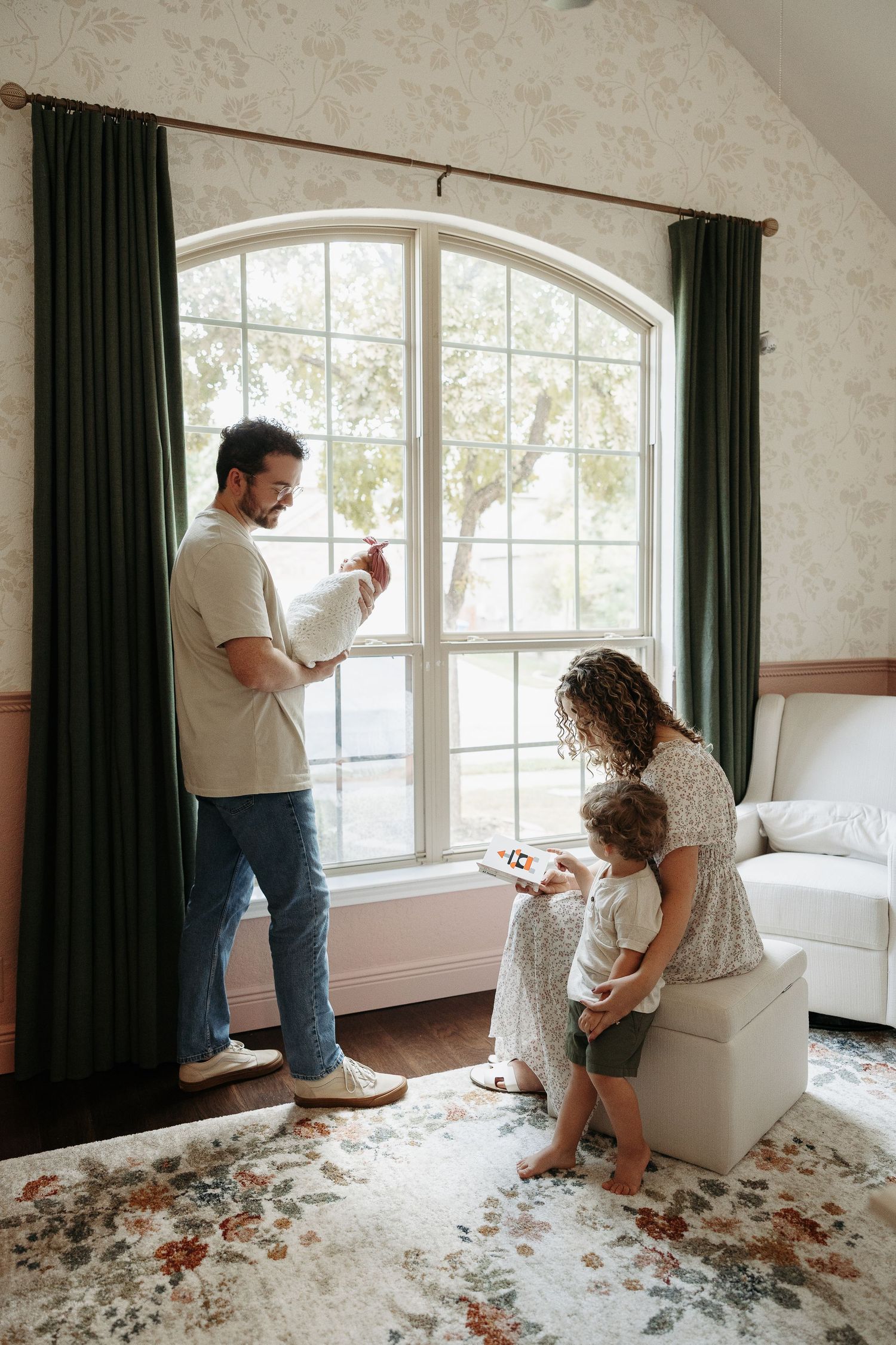 A series of five connected images showing the process of removing wallpaper from a room with large windows and dark curtains.