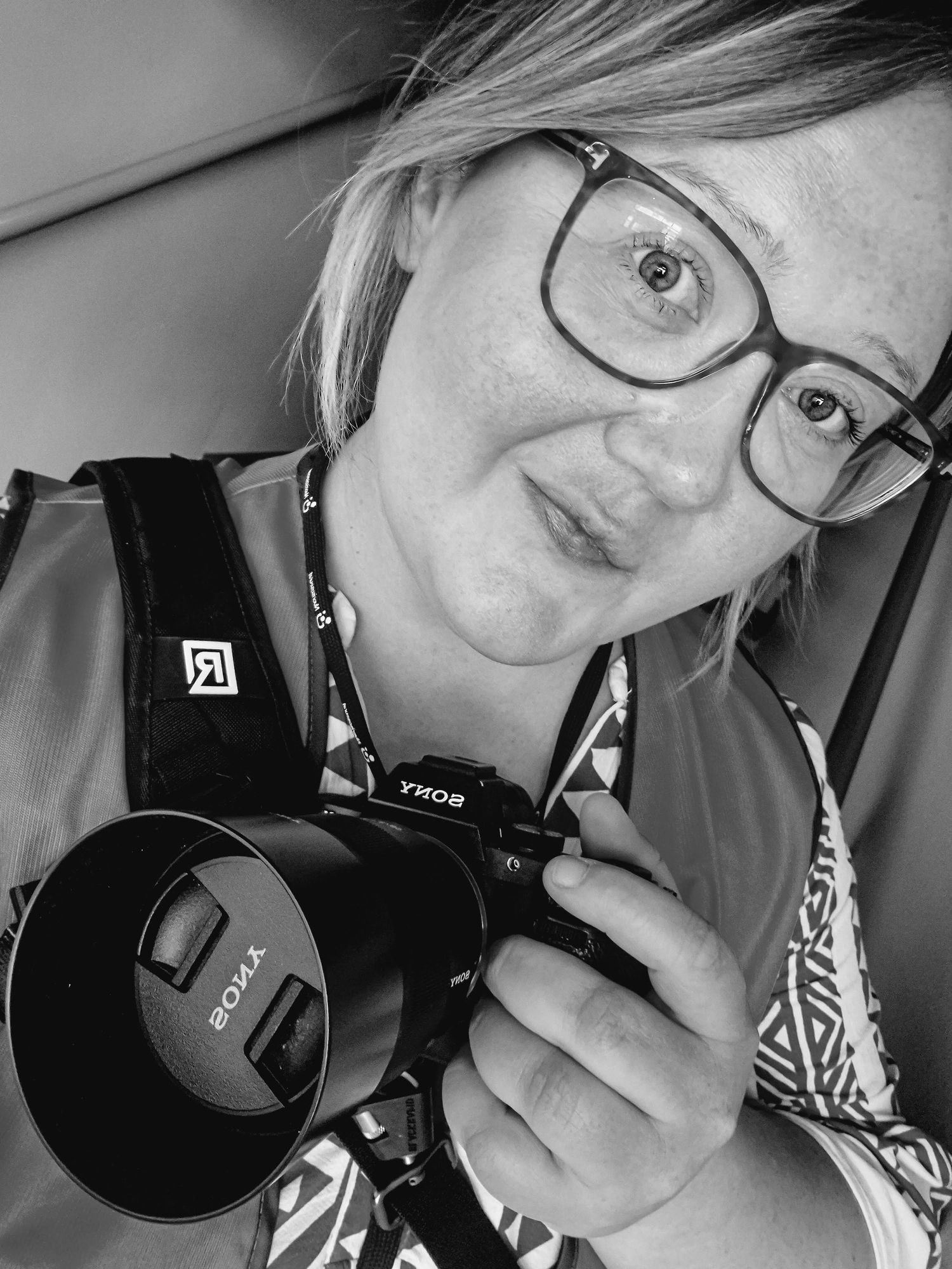 A series of black and white selfies taken from different angles showing a person wearing over-ear headphones.