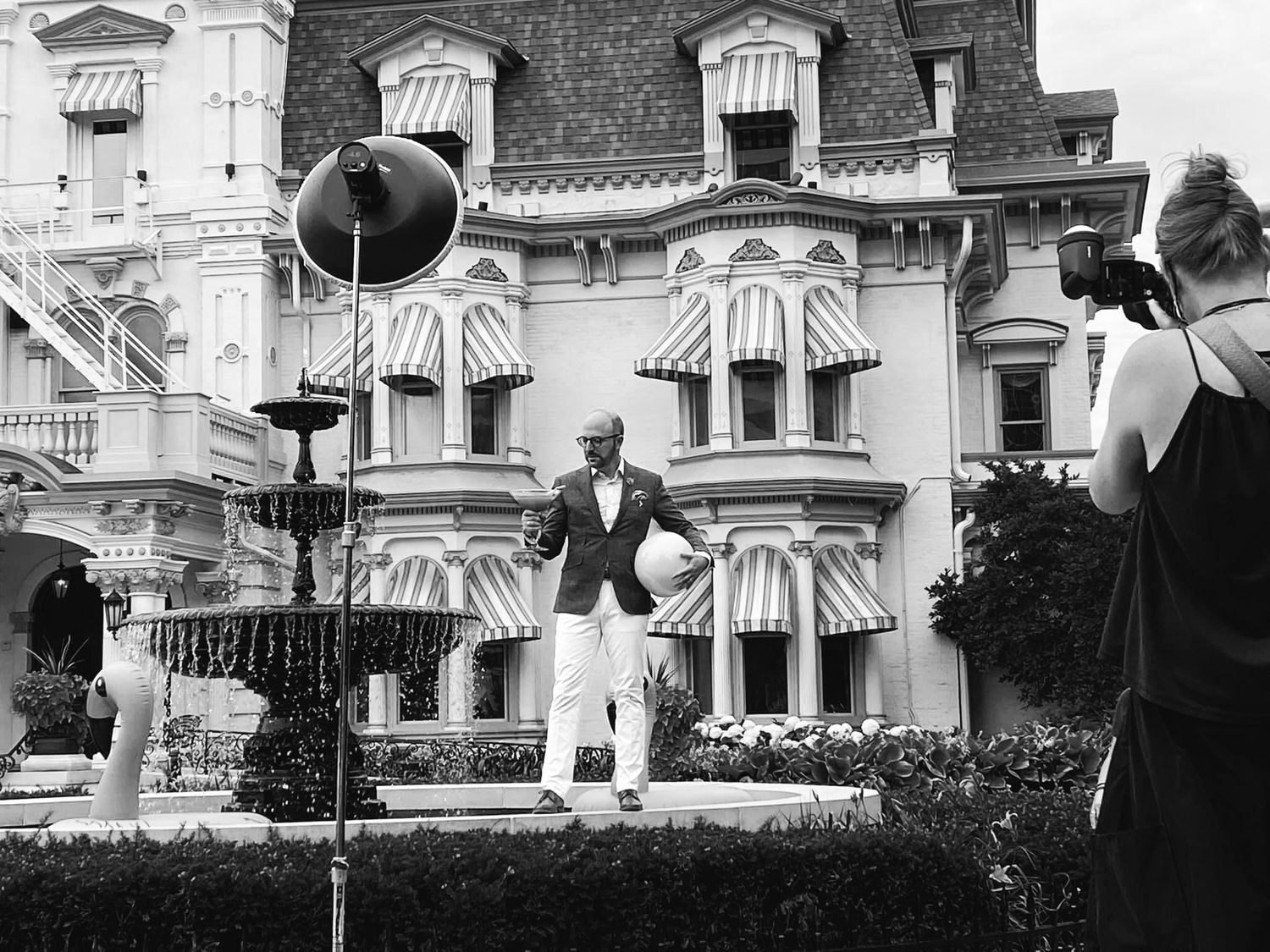 outside advertising photoshoot behind the scenes in black and white