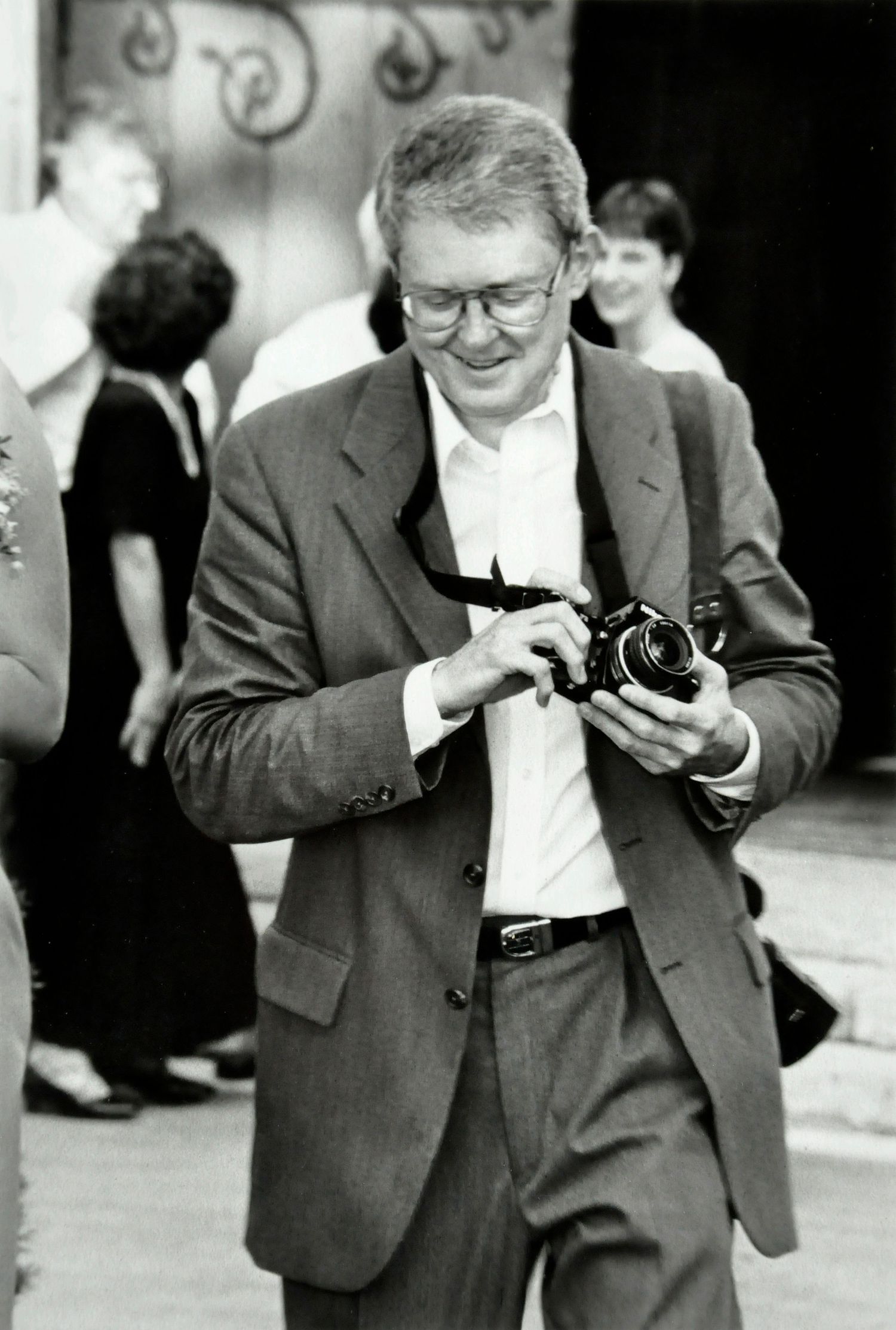 Photographer John Kimpel action portrait in black and white