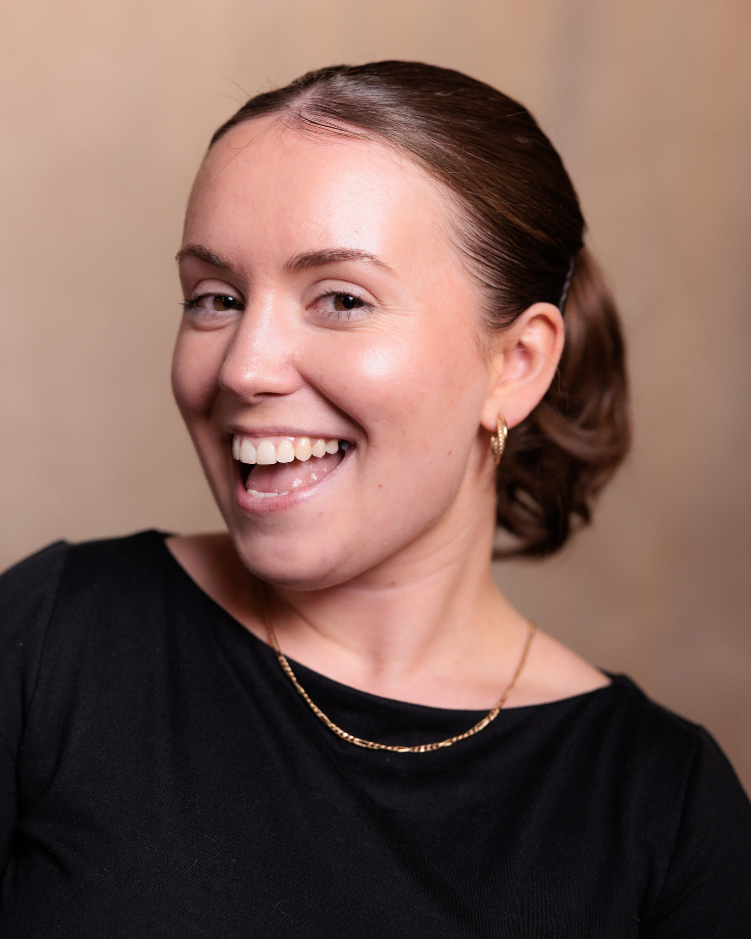 A series of five headshots showing playful expressions and poses against a neutral background.
