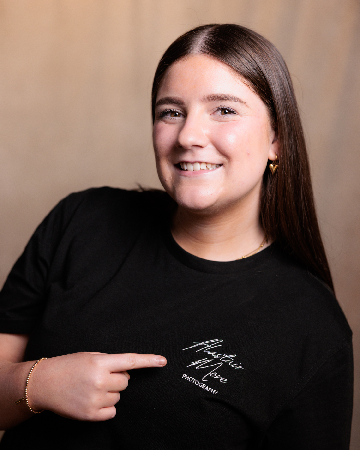 A series of headshots showing expressions progressing from serious to smiling against a neutral background.
