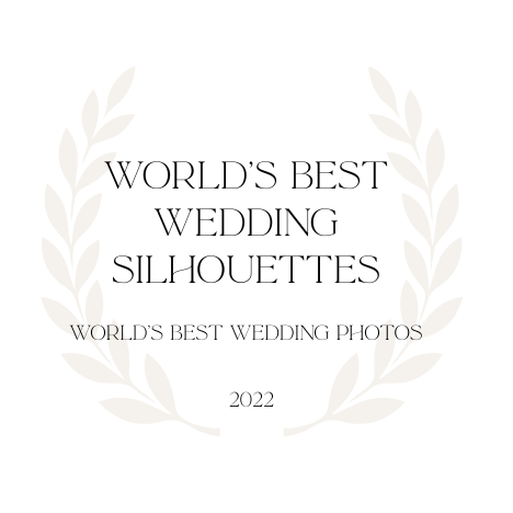 Elegant circular laurel wreath logo design for World's Best Wedding Silhouettes award in light beige and black.