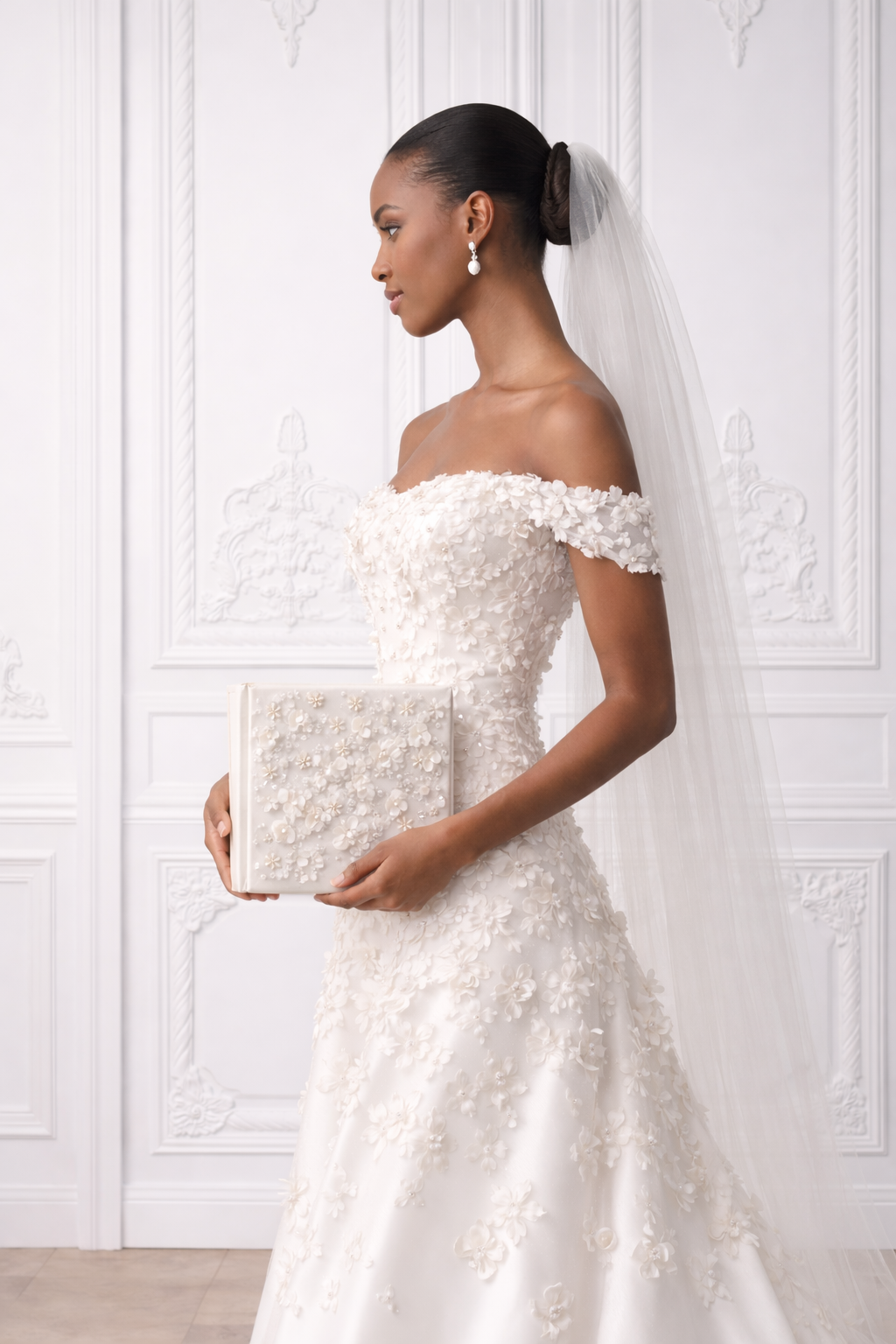 Elegant off-shoulder wedding gown with delicate floral appliques shown in four angles against white wall.