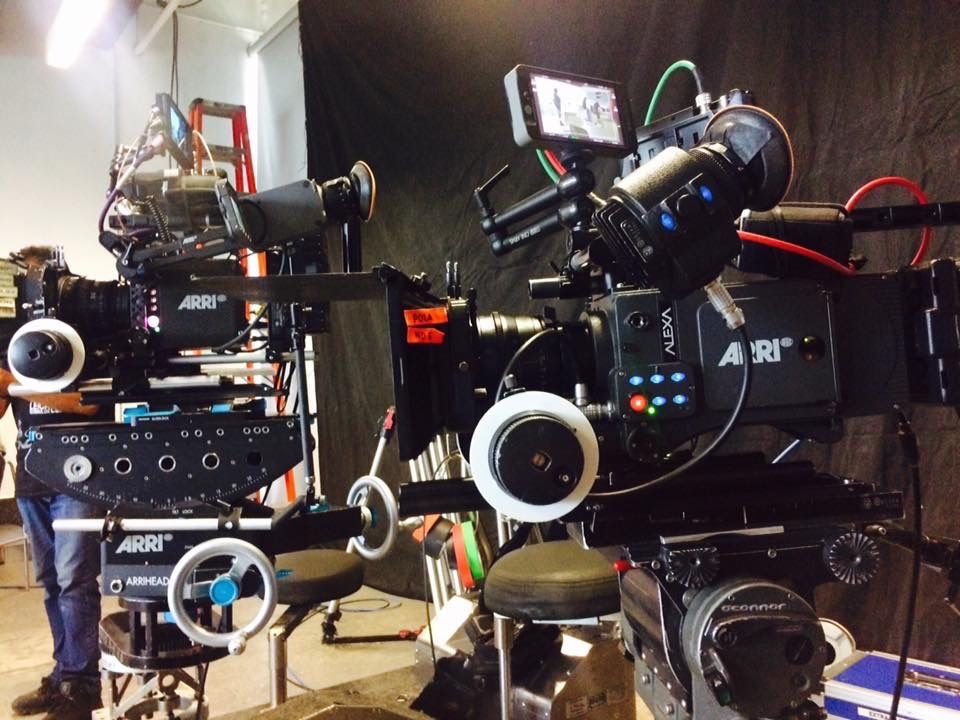 Two ARRI professional cinema cameras mounted on set ready for dual-camera film production.