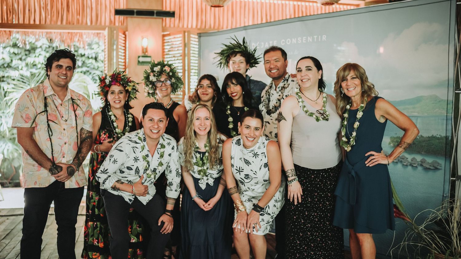 Group of people posing together at a Las Islas de Tahiti promotional event.