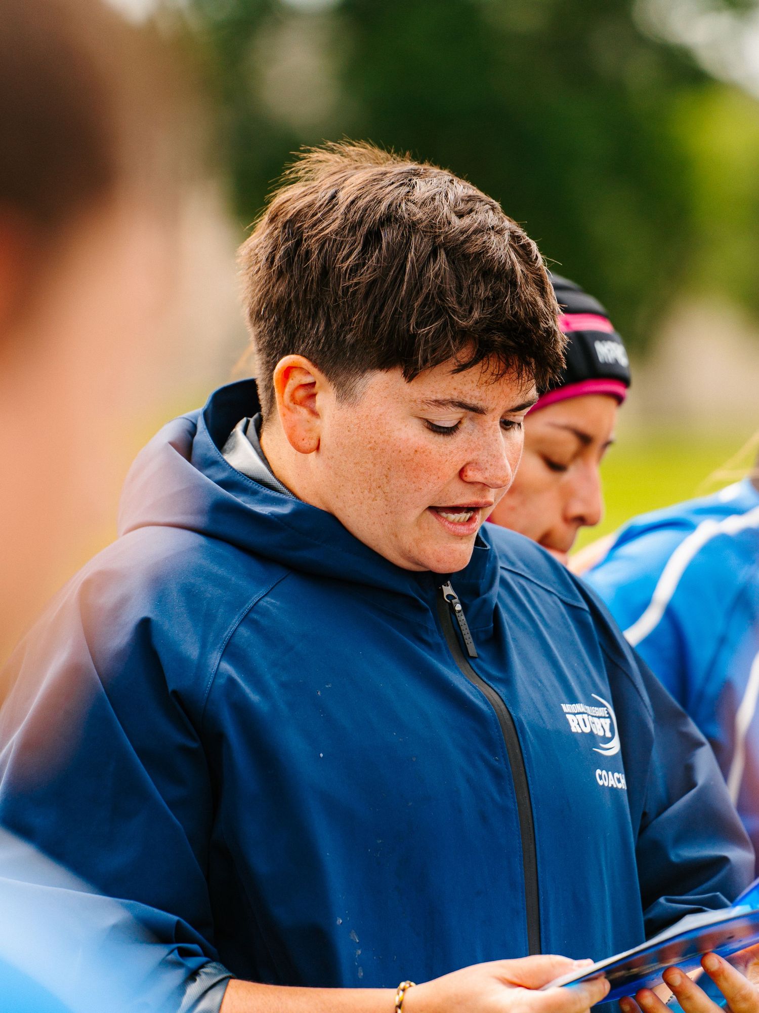 Rugby coach, Meridith Pyke, prepares her team for a tough contest.