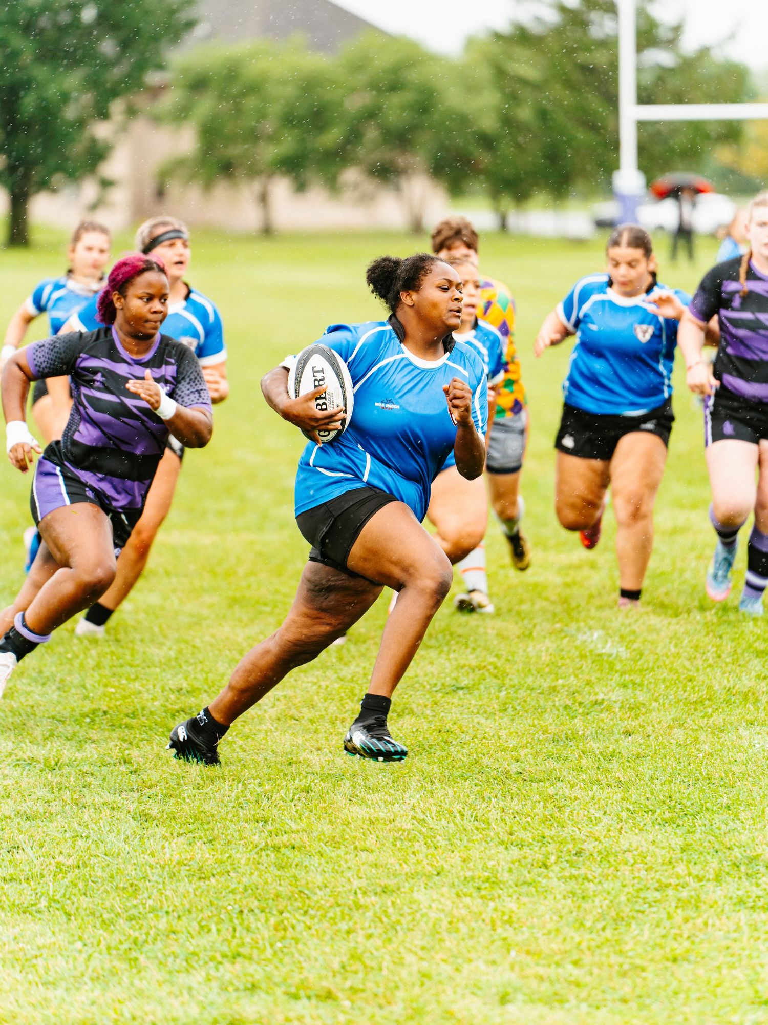 Bonnies Women's Rugby player, Sadie Hersehberger, powers through the defense.